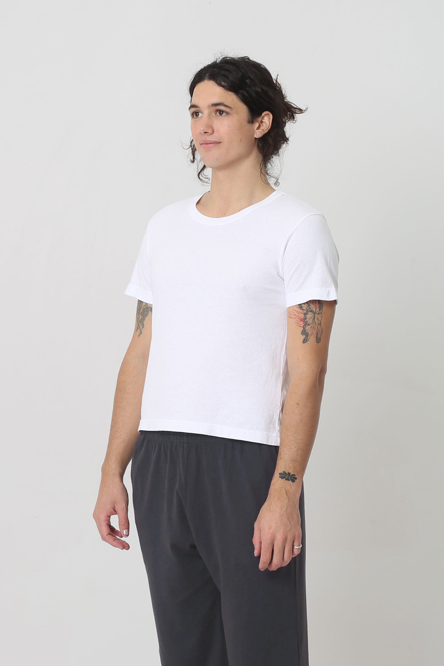 3/4 front view showing side seams and slim short sleeves.