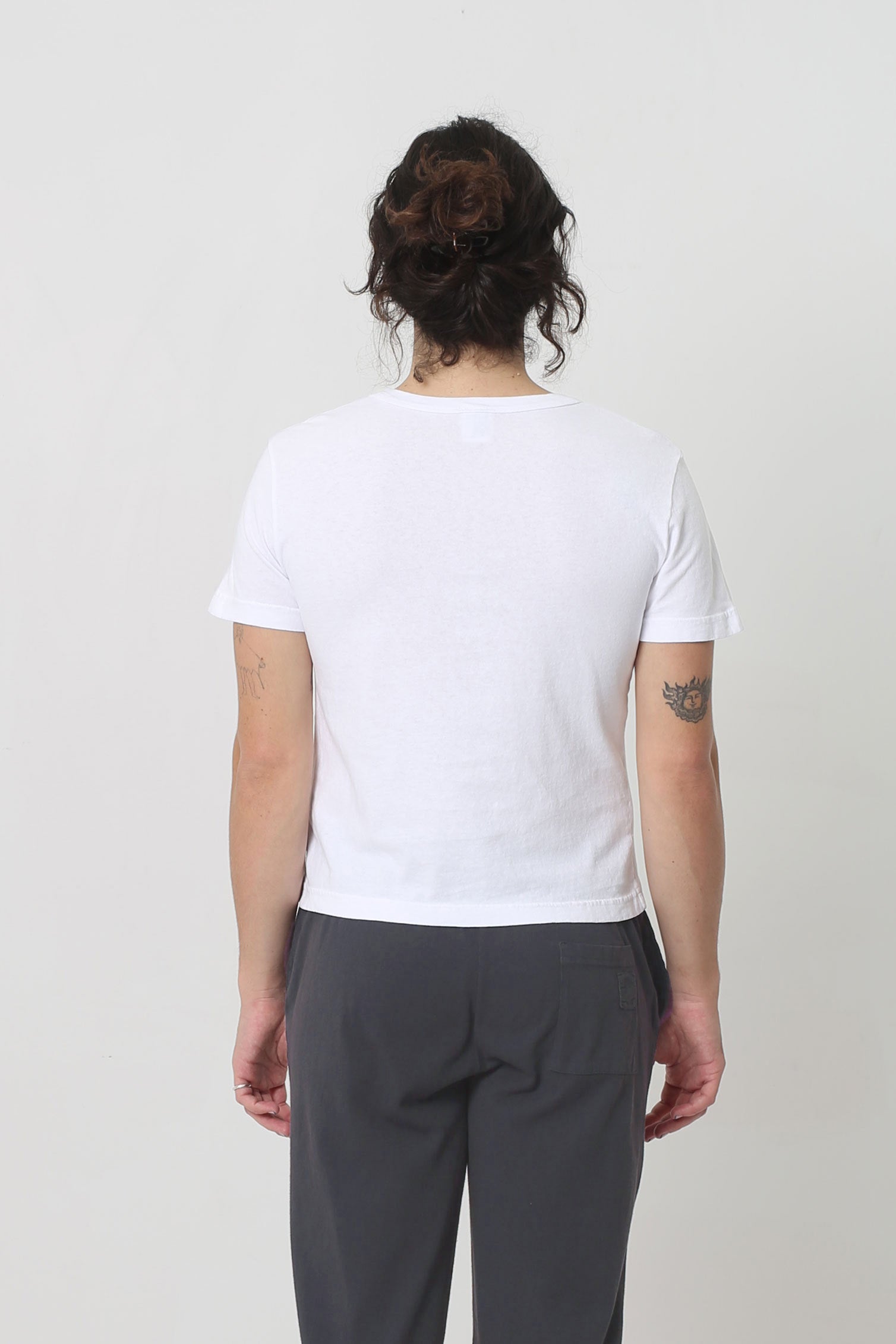 Back view: fitted across upper back and relaxed at middle and lower back 