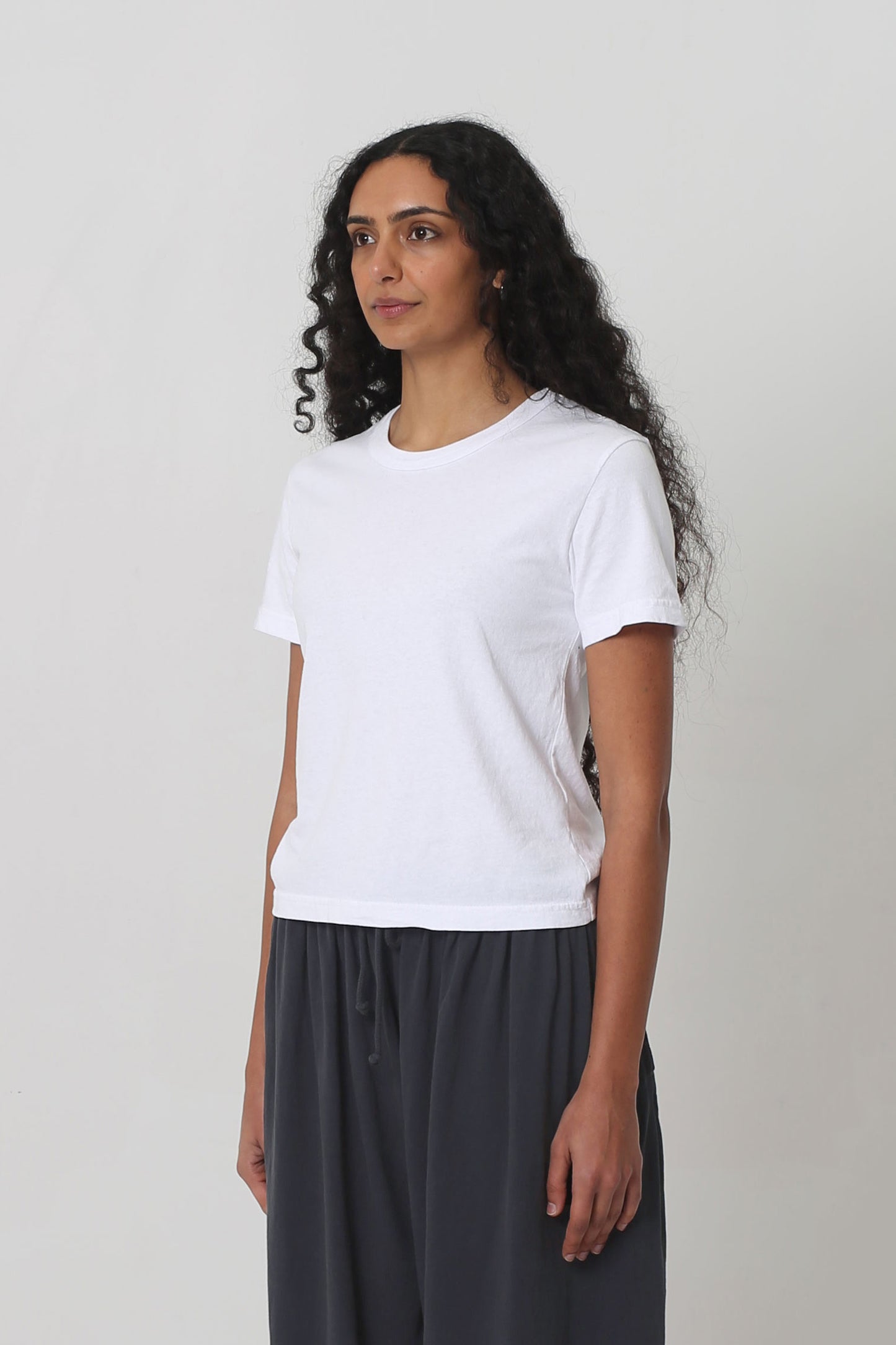 3/4 front view showing side seams and slim short sleeves.