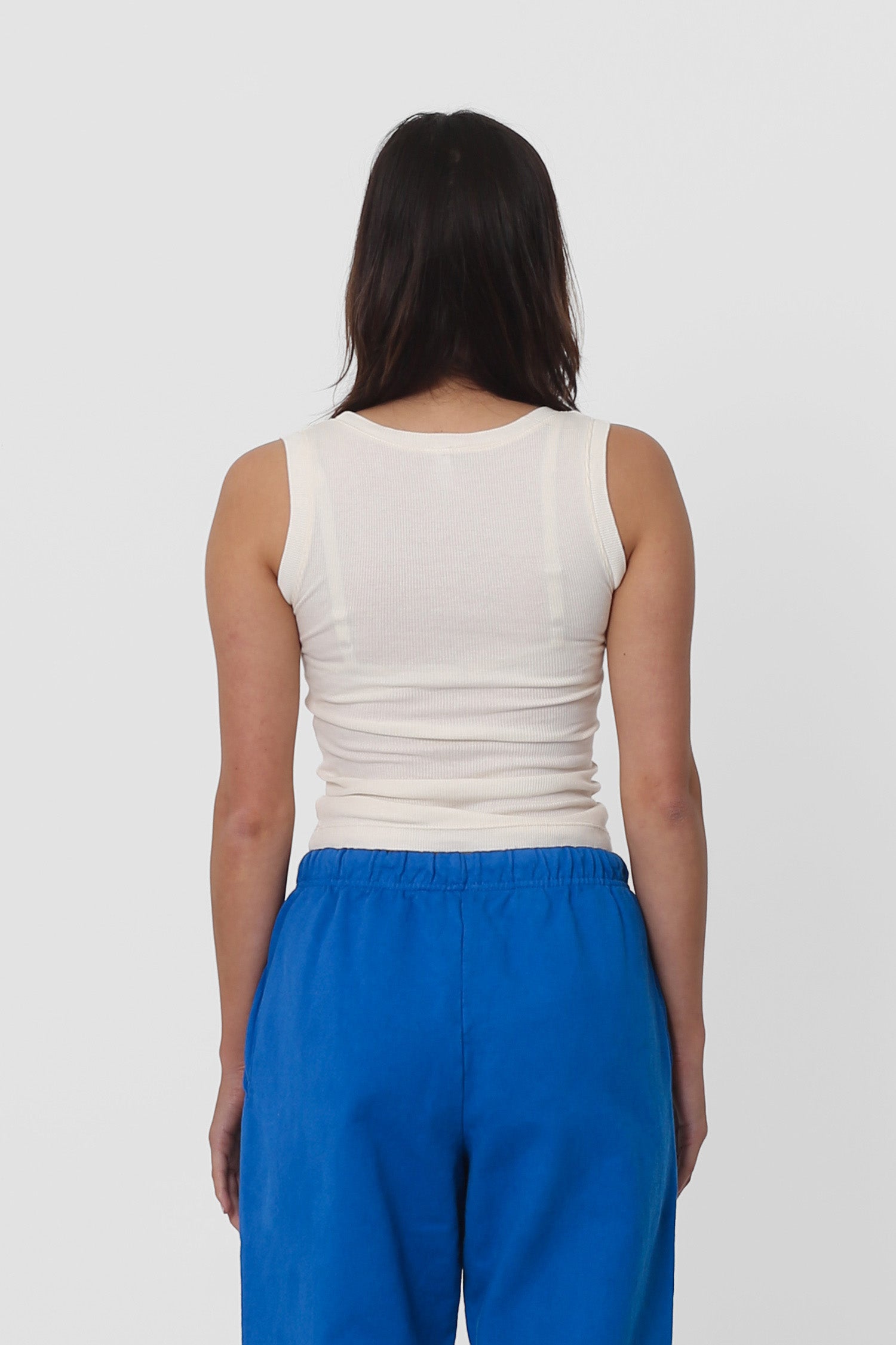 Back view: formfitting throughout and neckline higher than the front.