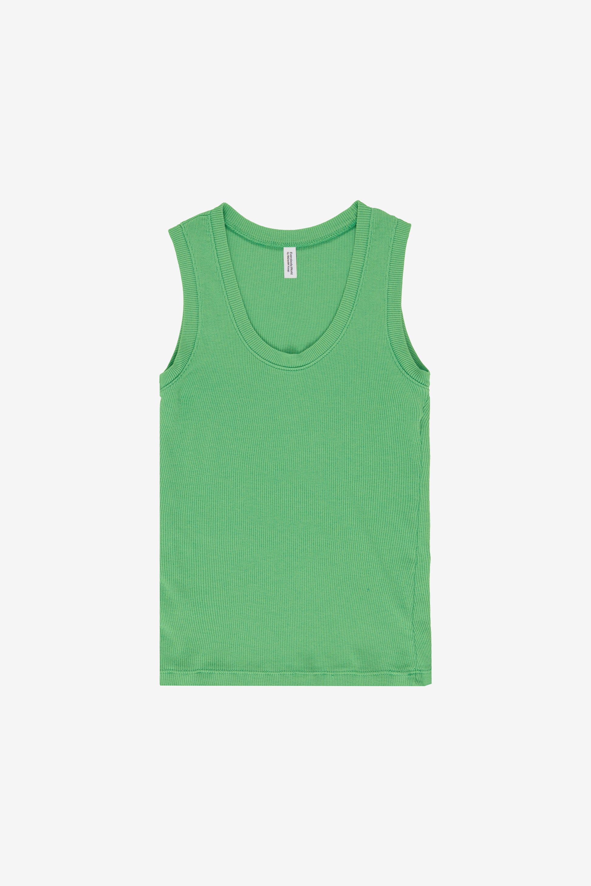 Flat lay reveals the tank’s unstretched form, which concaves slightly at the waist.