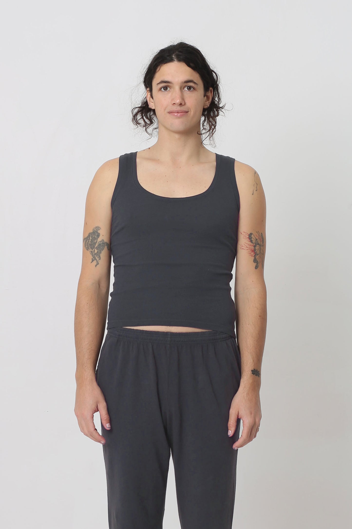6' person in a size S The Tank in Slate. Hem ends just above their hip bones.