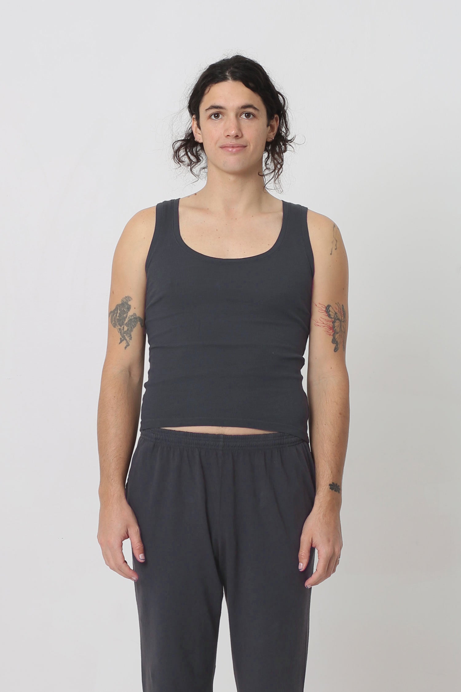 6' person in a size S The Tank in Slate. Hem ends just above their hip bones.