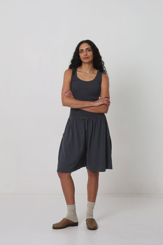 Styled with Slate Long Tubular Shorts and Plasticana Opana Mules.