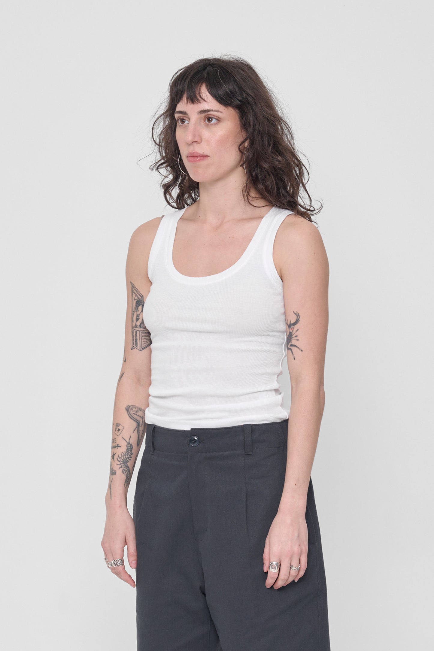 A person facing 45-degrees showing side seams and fitted silhouette.