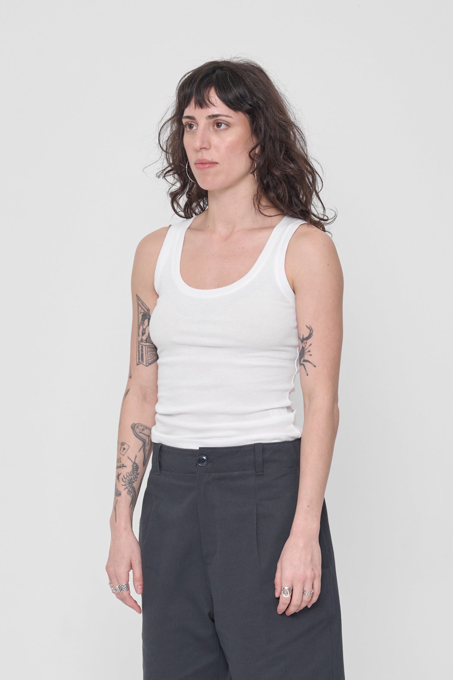 A person facing 45-degrees showing side seams and fitted silhouette.