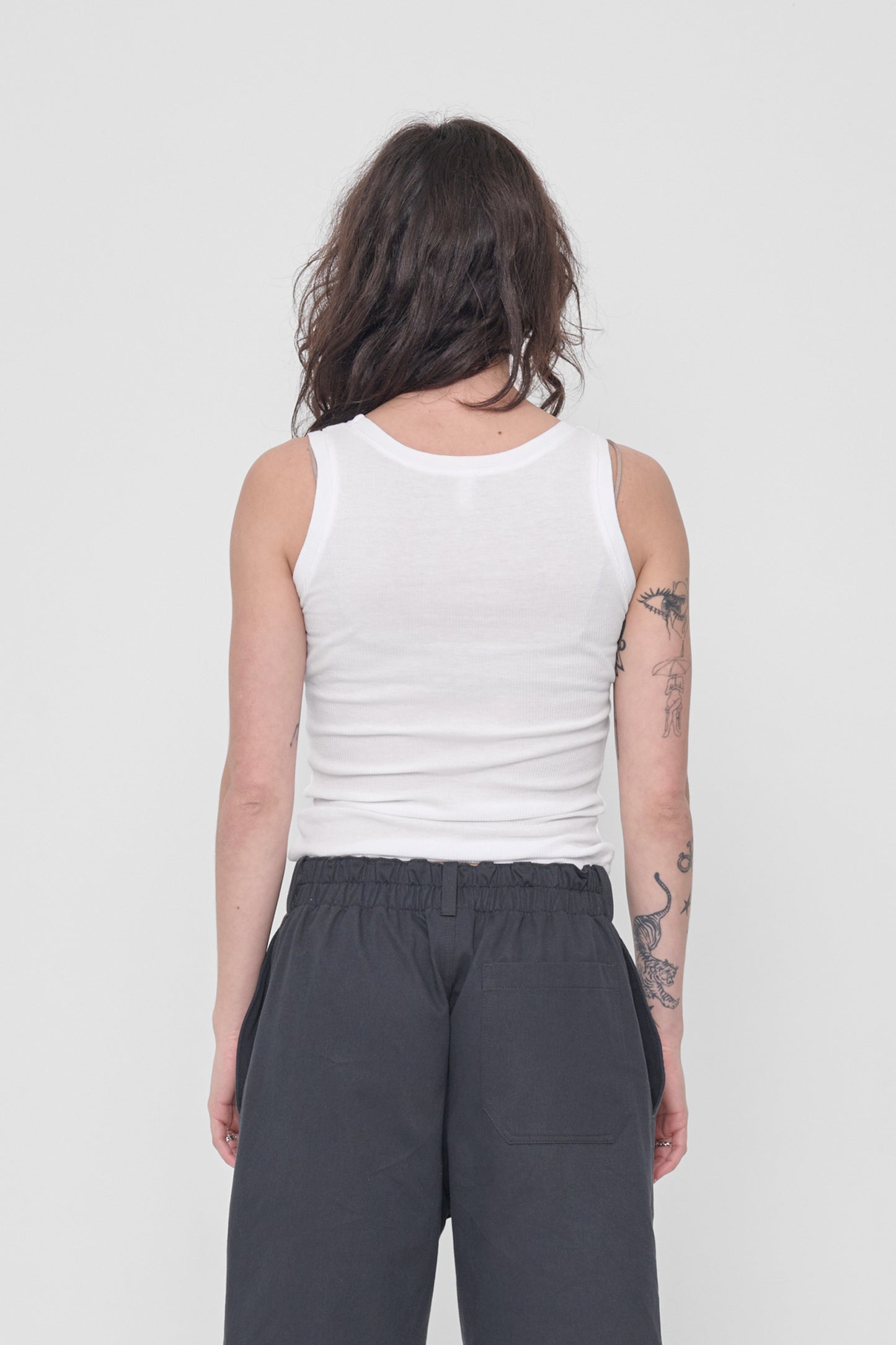 Back view: formfitting throughout and neckline higher than the front.