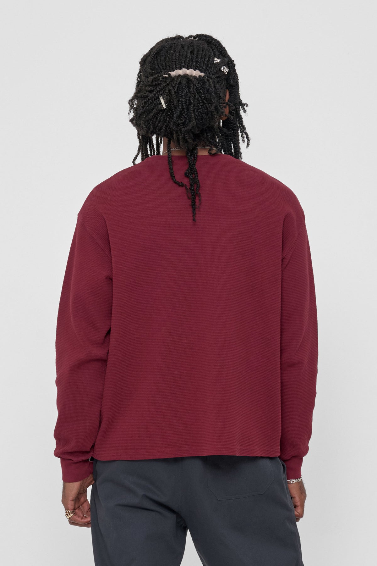 Thermal Trash Tee in Garnet – back view on model