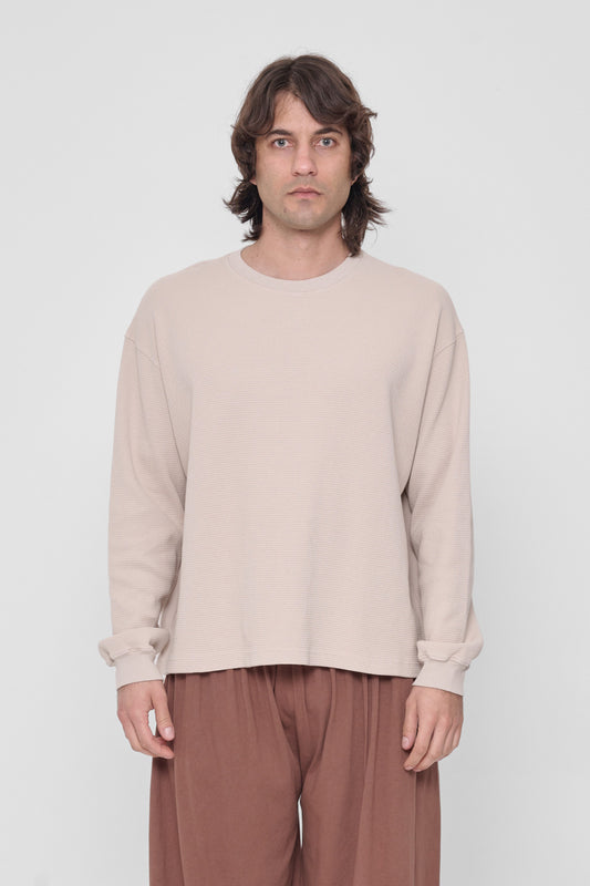 6'2" person in a size L Oat Thermal Long Sleeve Boxier Trash Tee. Hem hits the middle hip. 