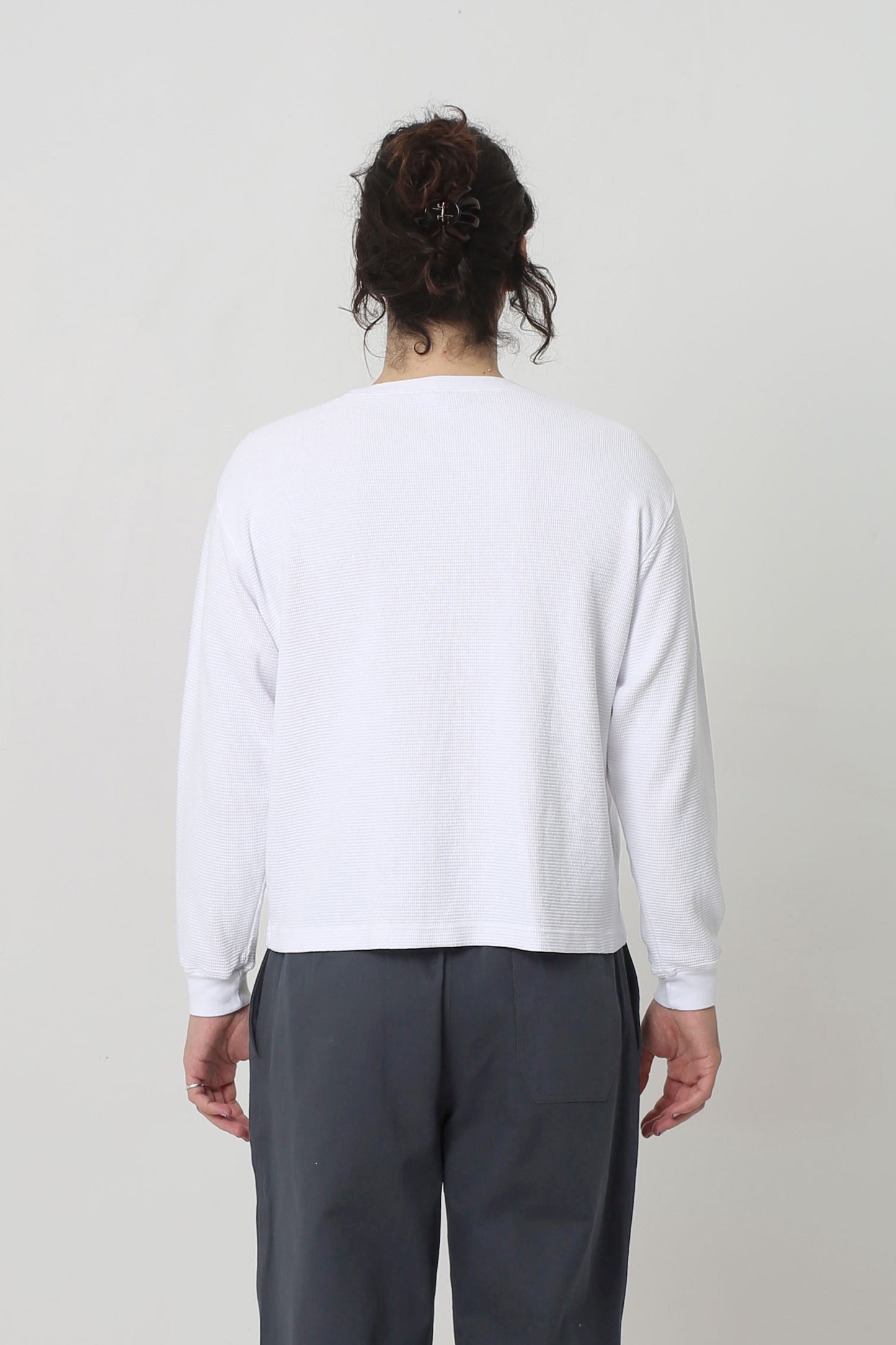 Back view shows relaxed fit throughout except for rib cuff