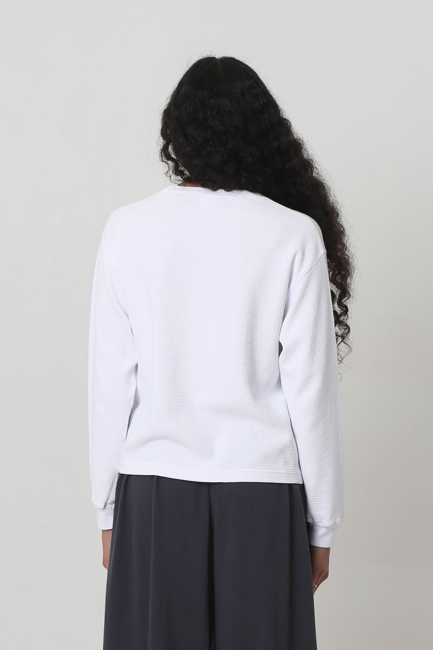 Back view shows relaxed fit throughout except for rib cuff