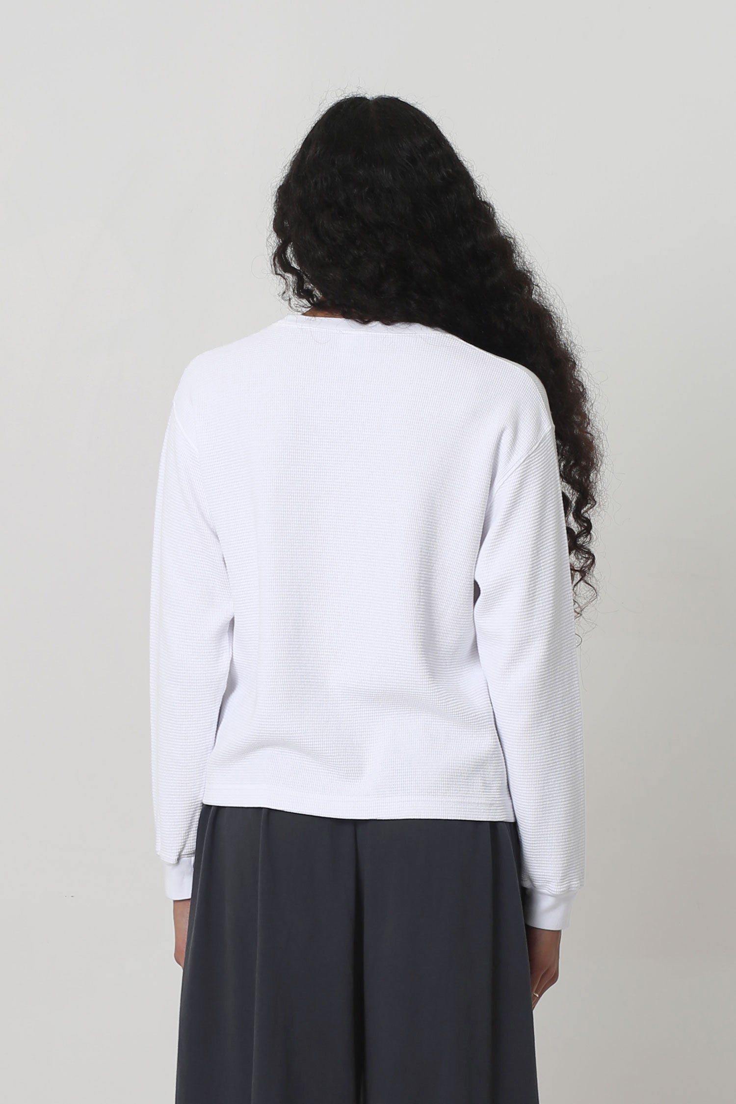 Back view shows relaxed fit throughout except for rib cuff