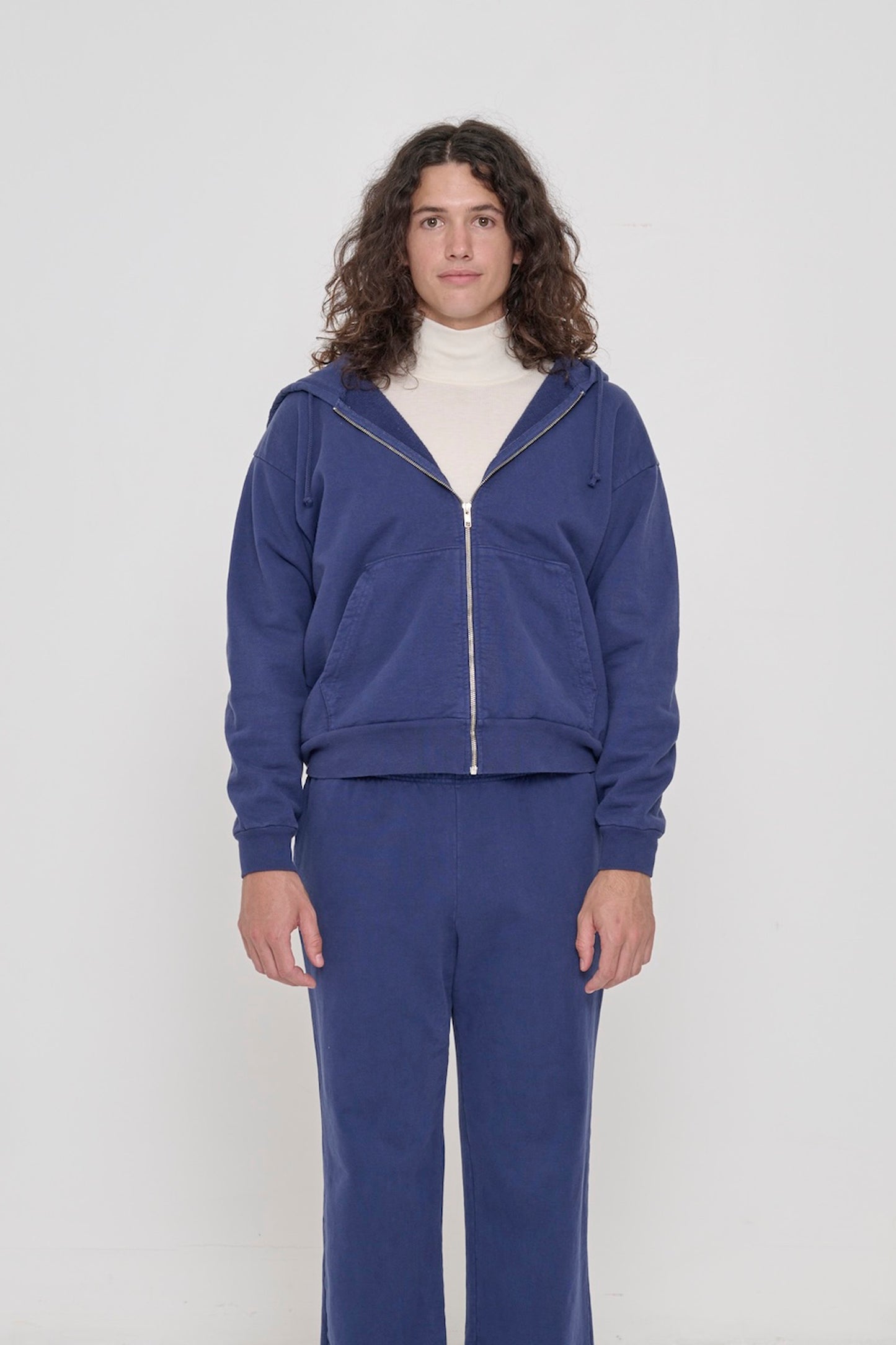 Front view: 6' person wearing Washed Navy Trash Zip Up Hoodie in size S. Hem hits his upper hip.