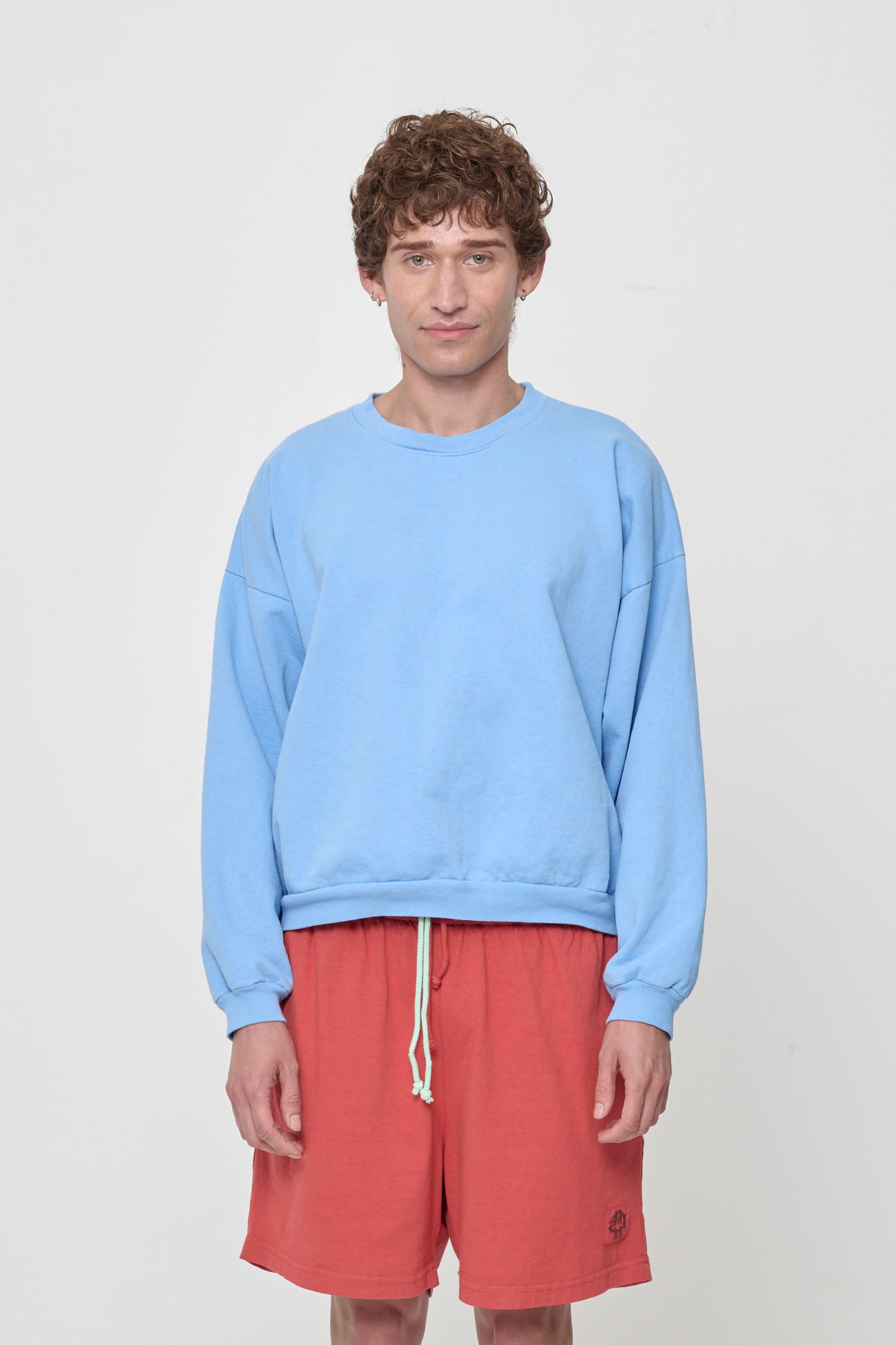 Front view: 5'11" person wearing Cielo Trash Crewneck in size M. Hem hits their upper middle hip.