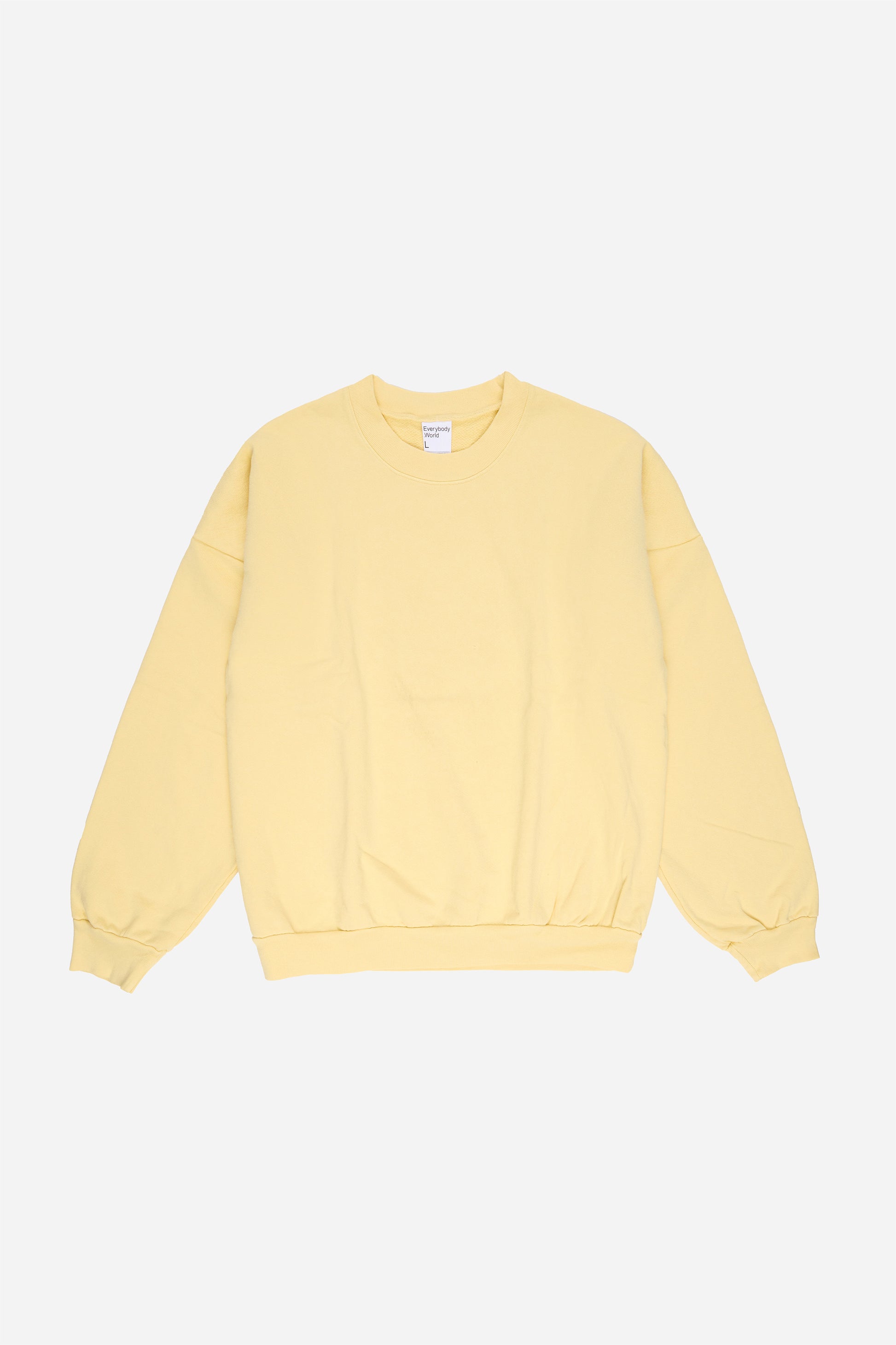 Flat lay front view of light yellow French Butter Trash Crewneck.