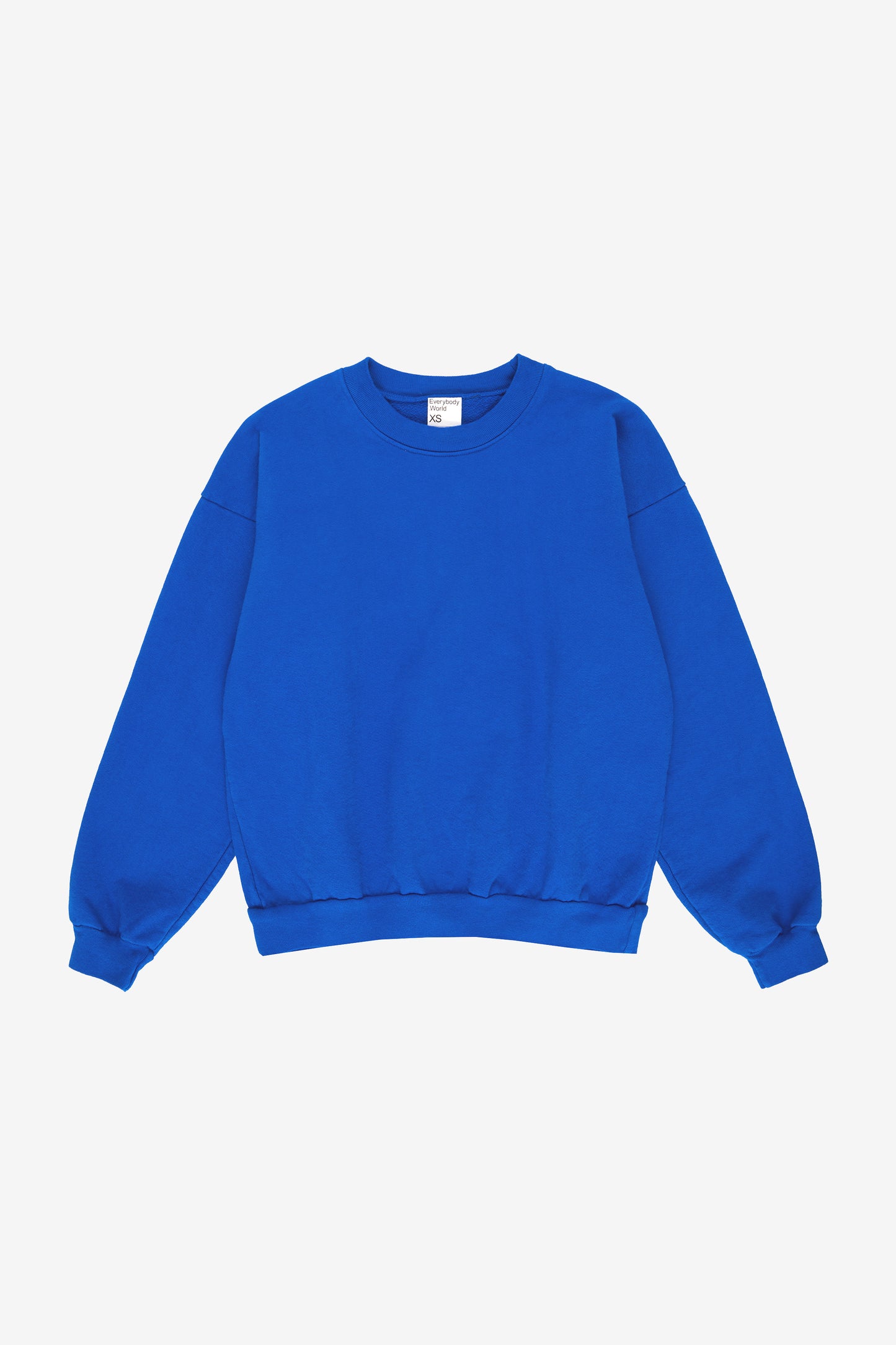 Flat lay: roomy body and sleeves with gathered fabric at rib knit cuffs and waistband.