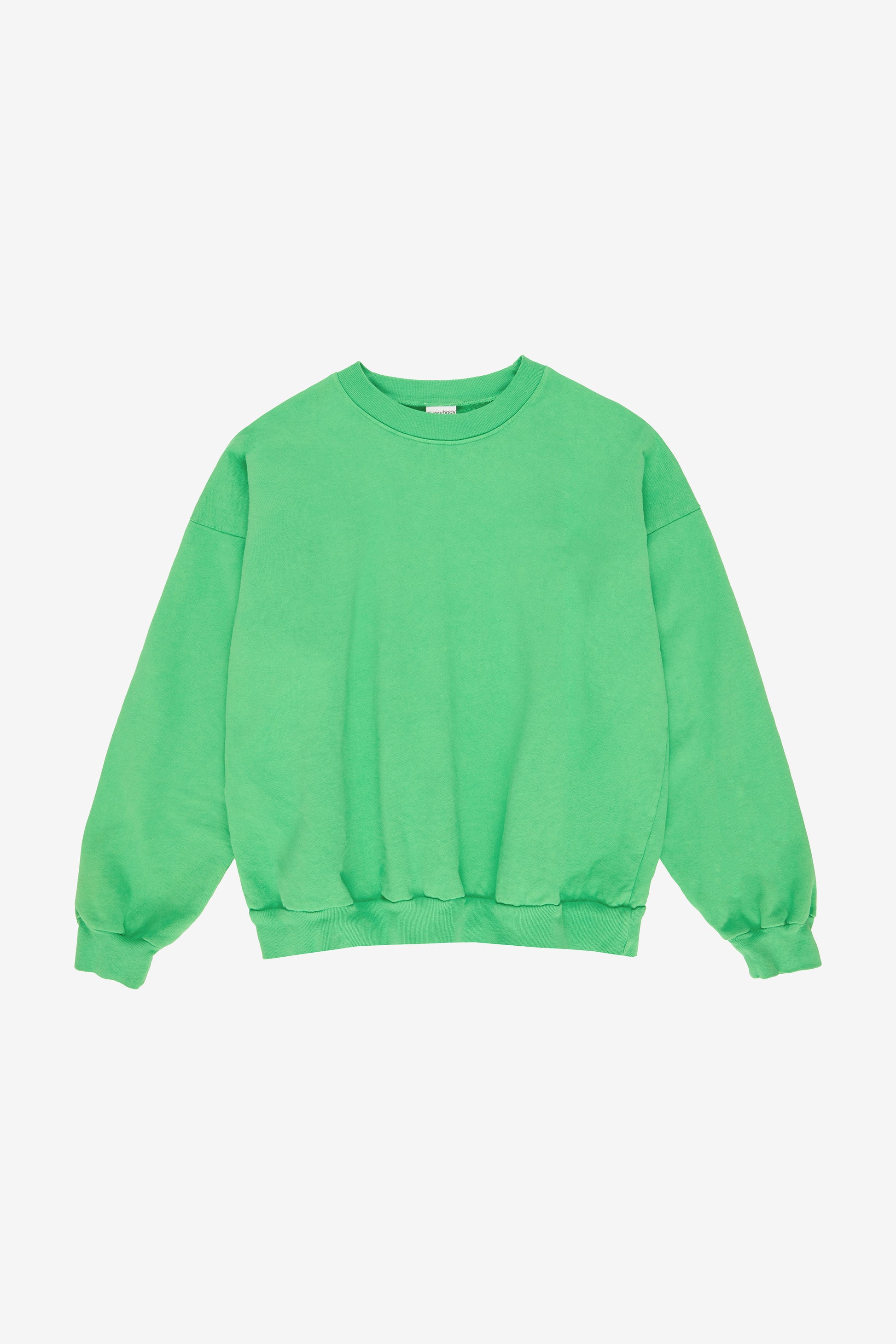 Flat lay: roomy body and sleeves with gathered fabric at rib knit cuffs and waistband.