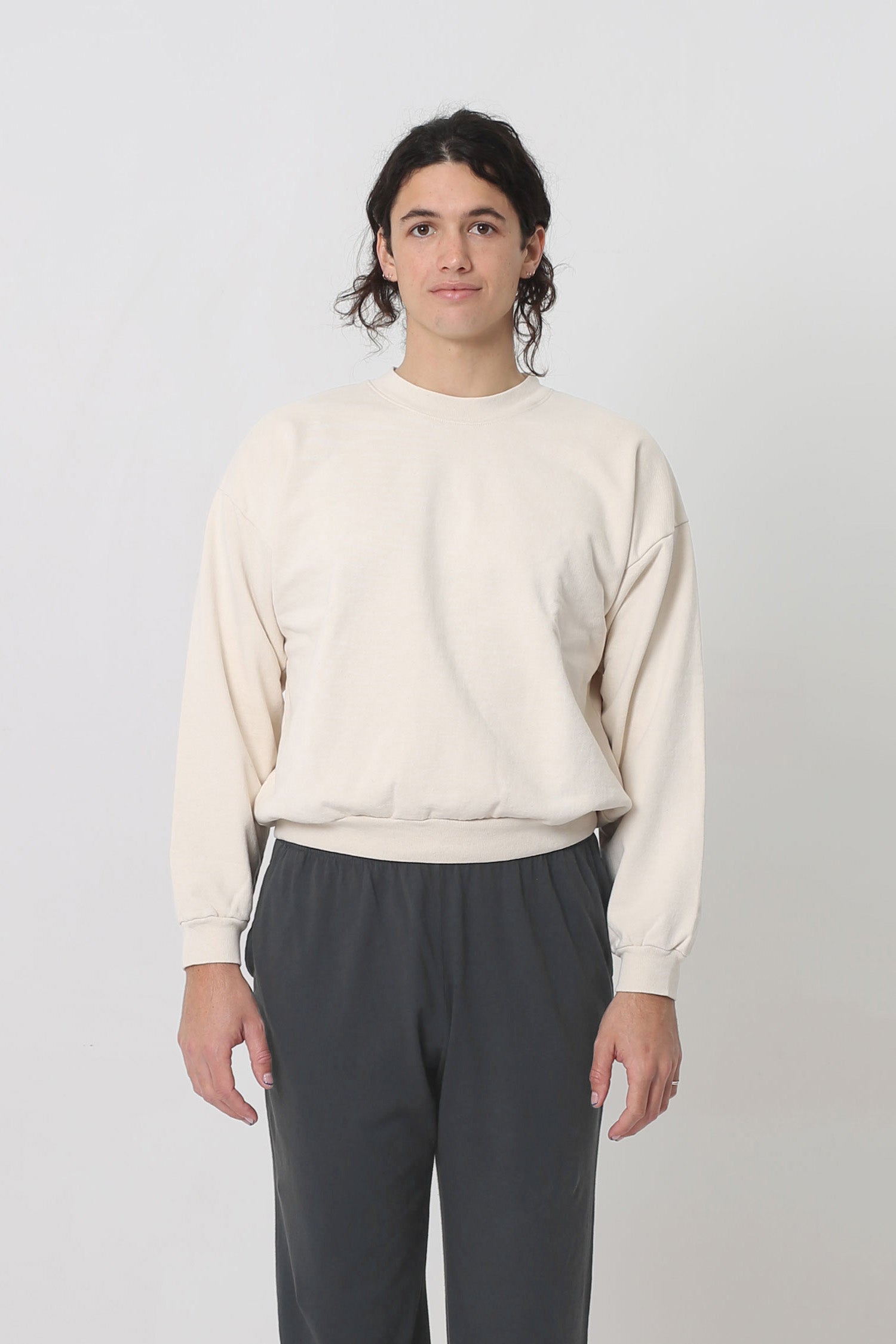 A 6' person in a Scour Trash Crewneck in size S. Hem hits the upper hip.