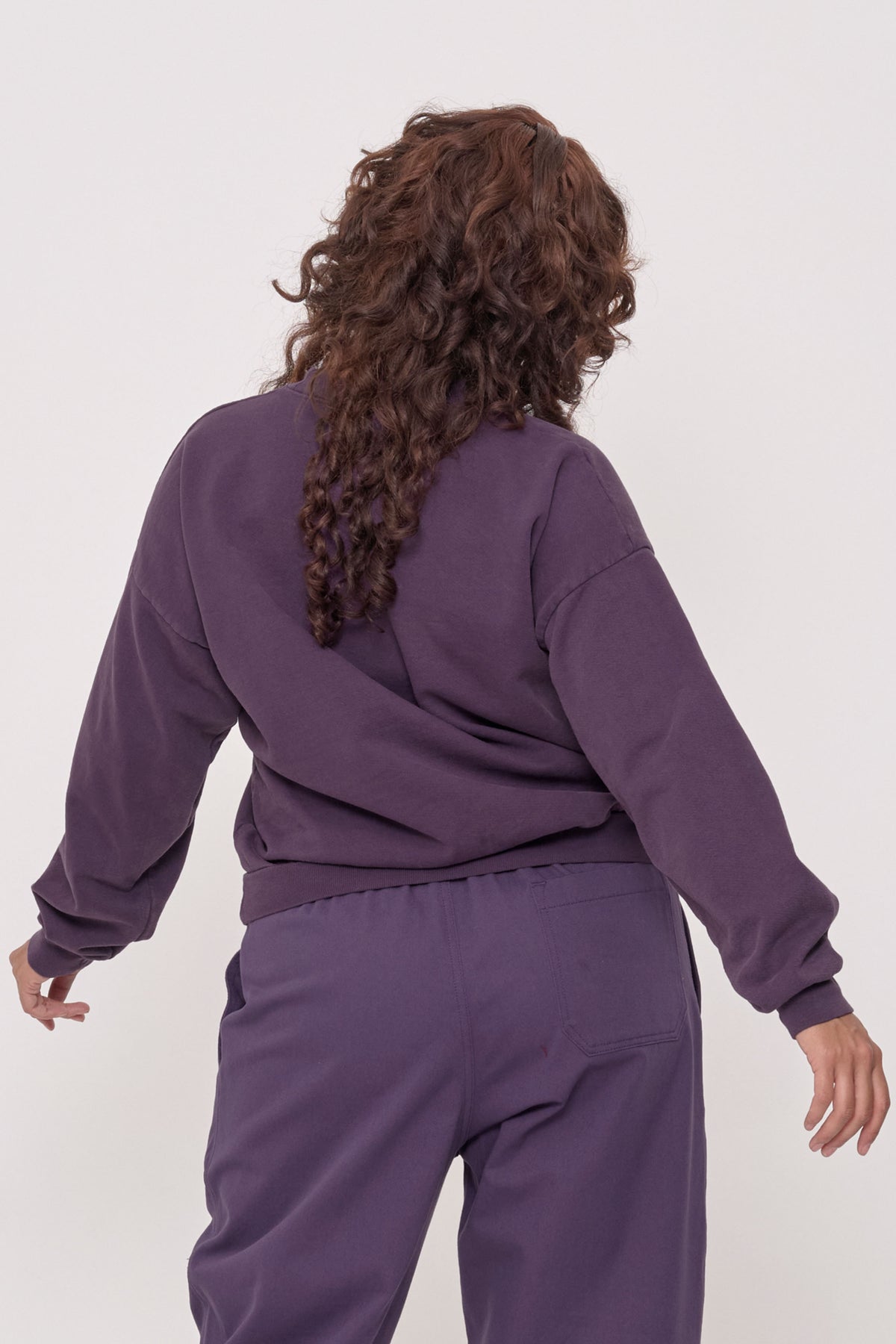 Trash Crewneck in Washed Mulberry – back view on model