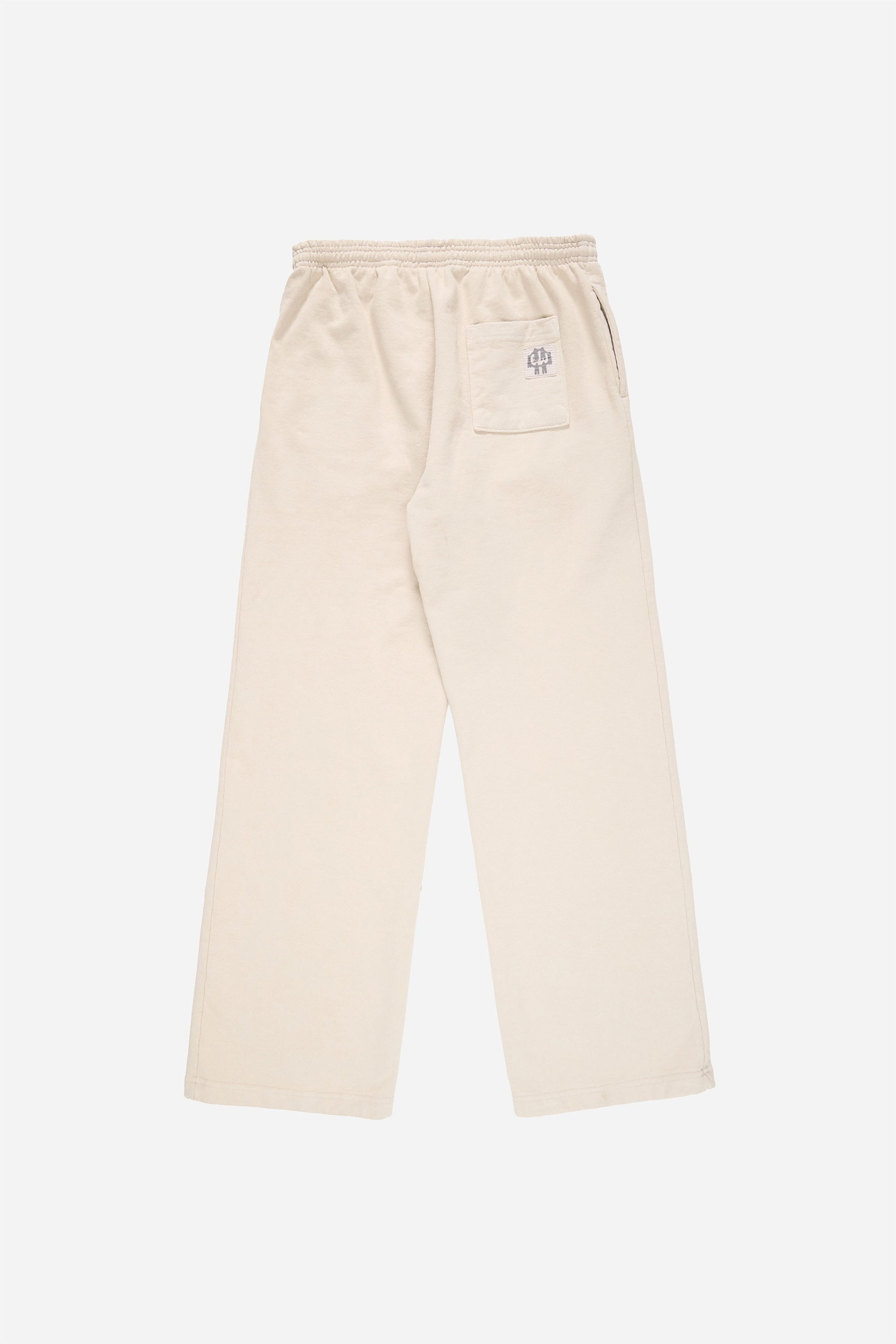 Flat lay of Trash Fleece Apartment Pants in Oat, showing the back of the leg and the pocket detail.