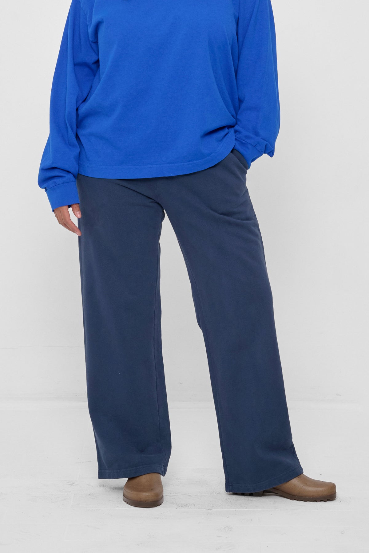Trash Fleece Apartment Pants in Washed Navy - front view on model