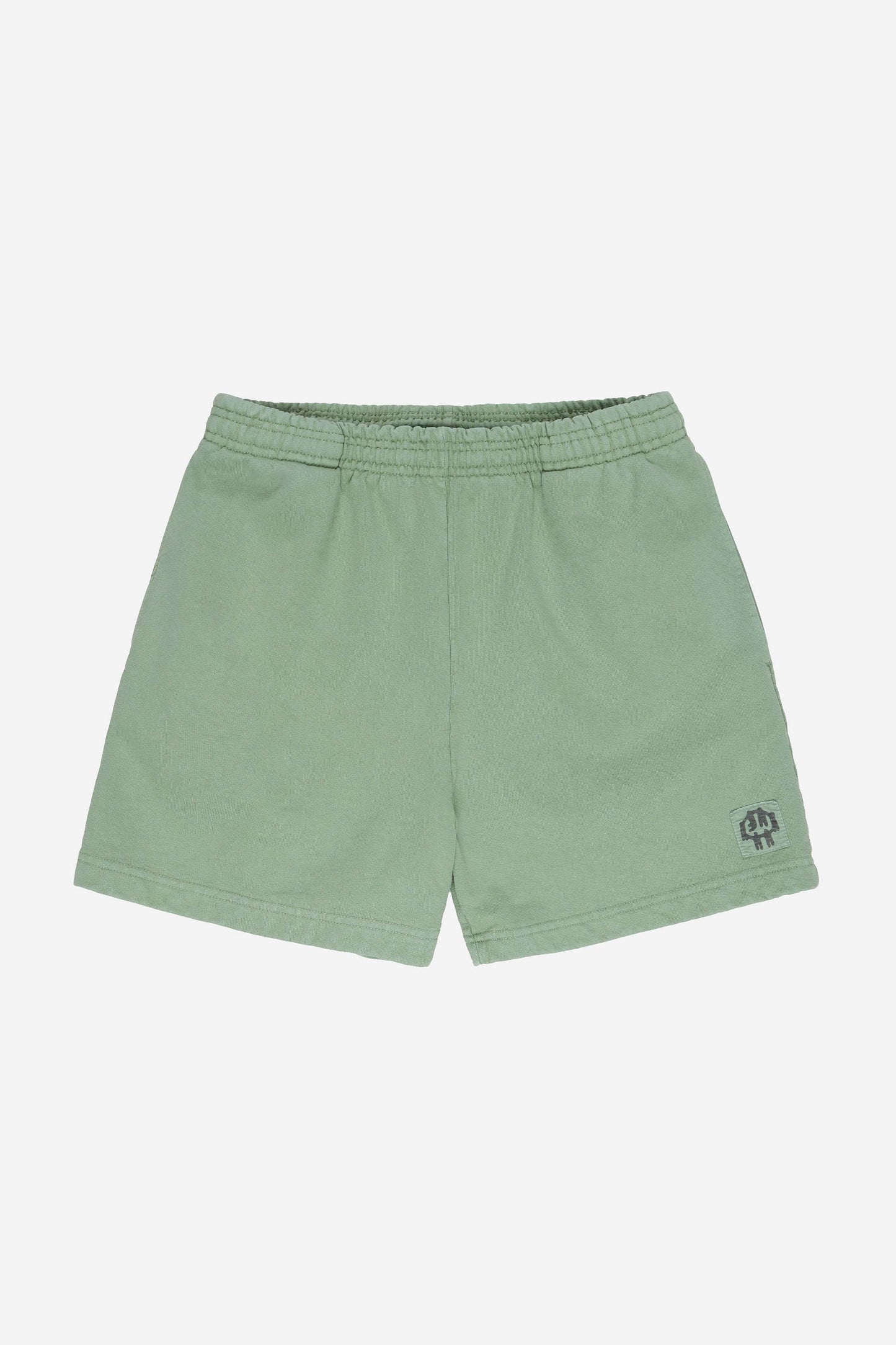 Flat lay of Wasabi Trash Fleece Everyday Shorts shows elastic waist and E.W patch logo on bottom left shorts leg.