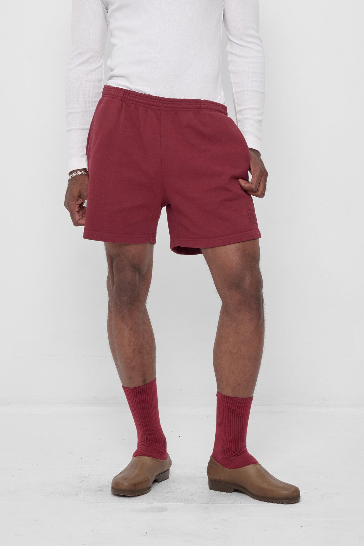 Trash Fleece Everyday Shorts in Garnet – front view on model