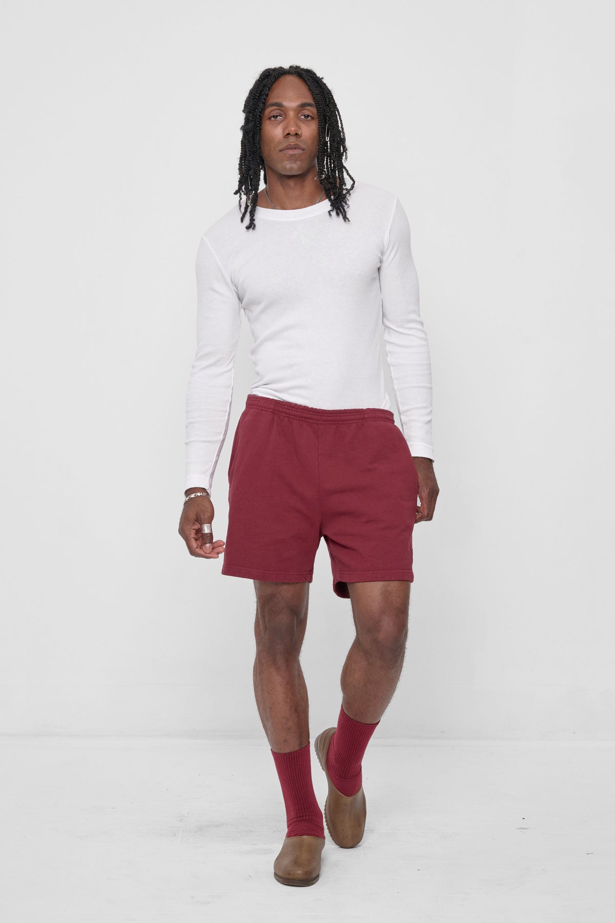 Trash Fleece Everyday Shorts in Garnet – front view on model, styled with White Rib Long sleeve, Garnet socks, and Plasticana shoes