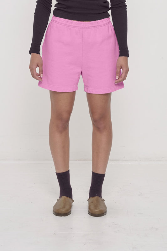 Waist down of a 5'8" person in Size M Pixie pink Trash Fleece Everyday Shorts. Hem at mid thigh.