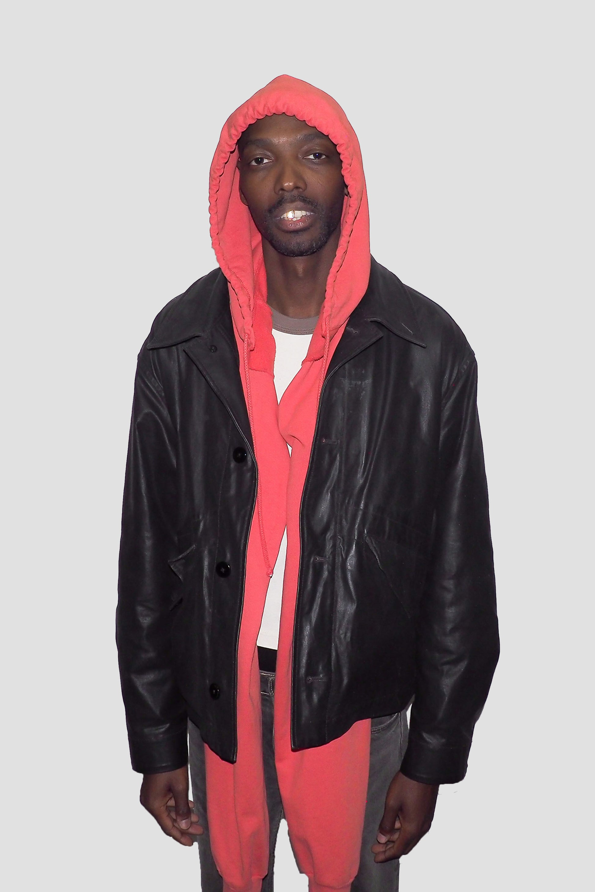 Model wearing Cedar Clyde x Everybody.World Hoodie Scarf and leather jacket.