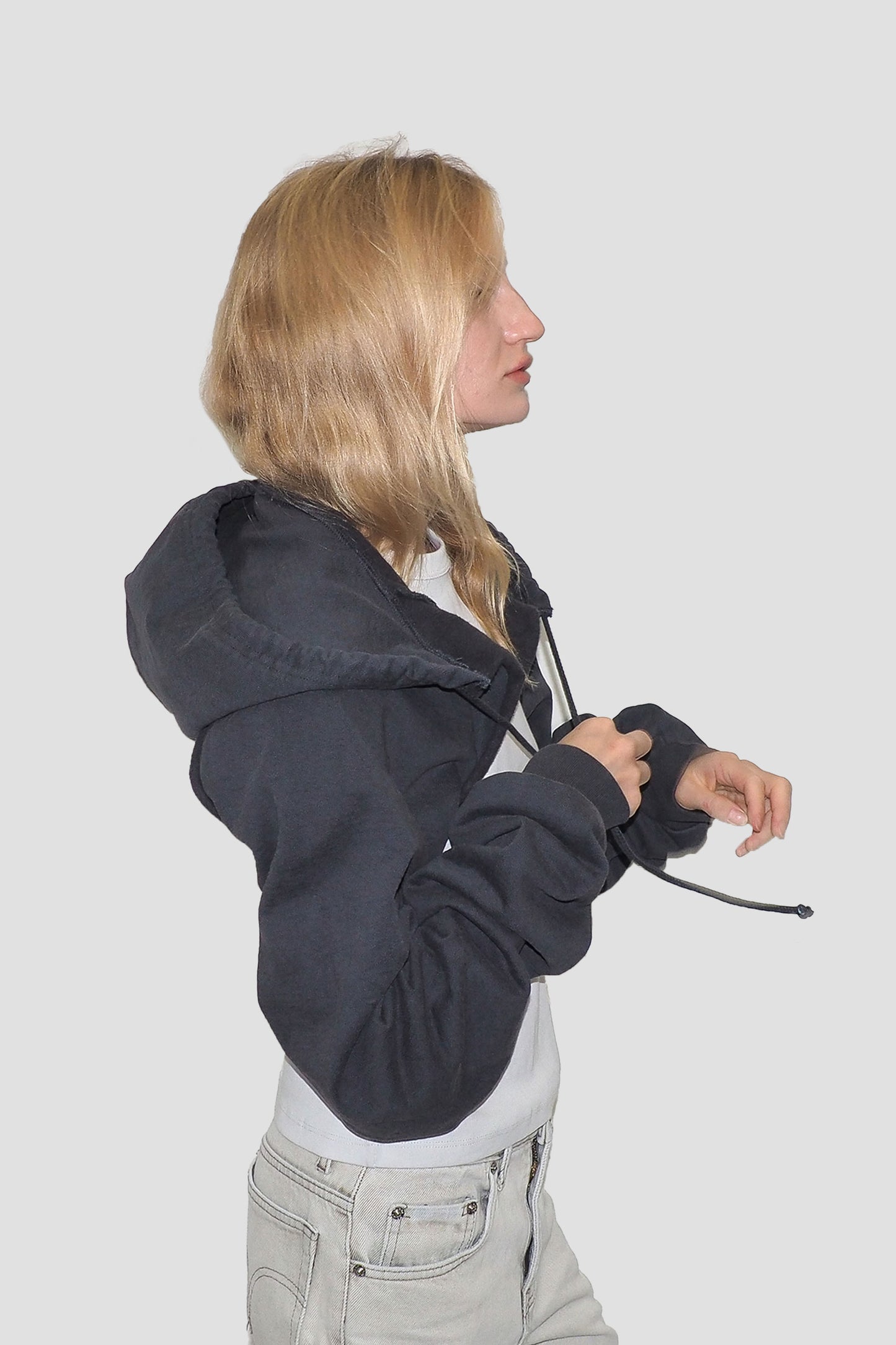 Side view with hood down and arms through the sleeves