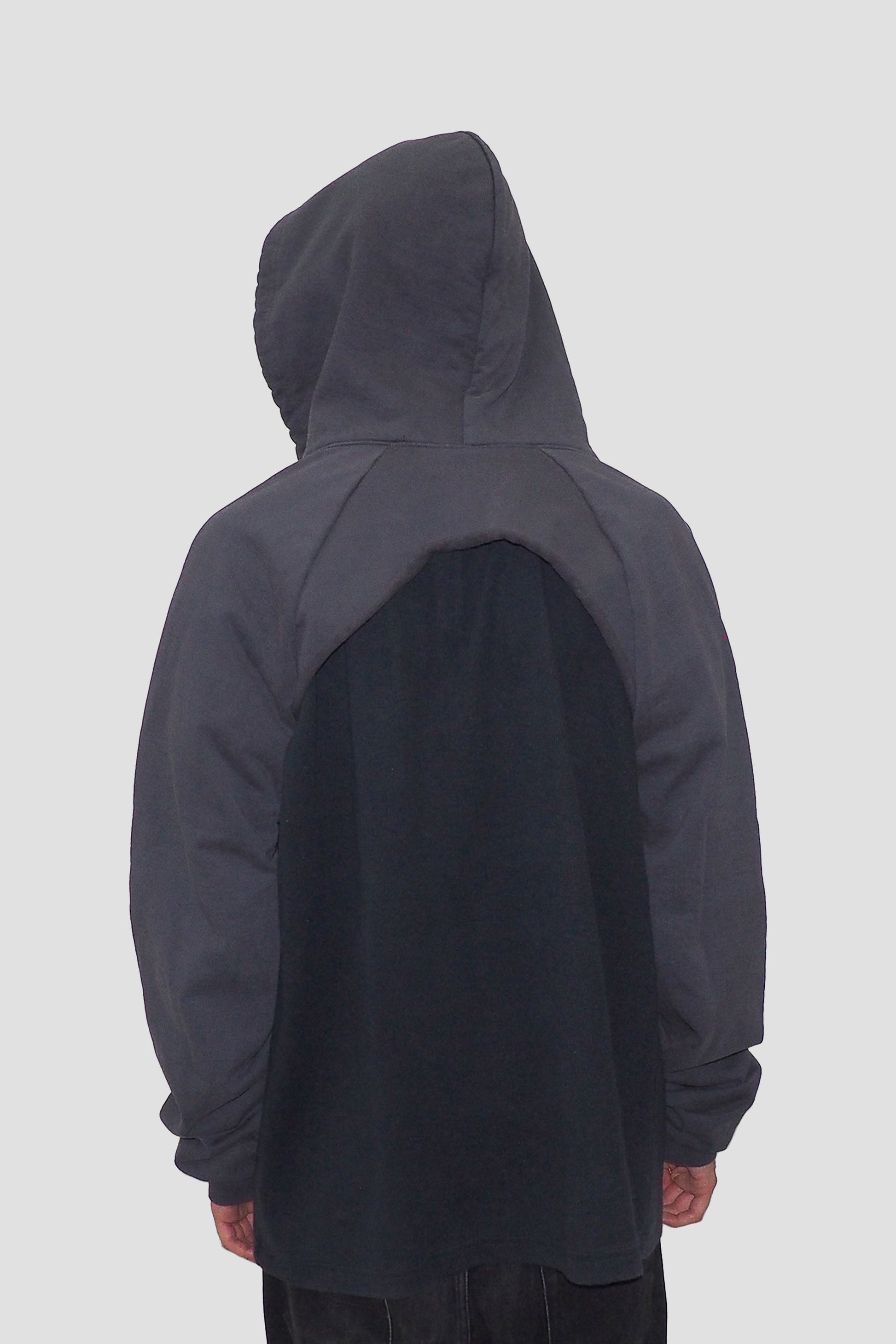 Back view with hood on and arms through the sleeves