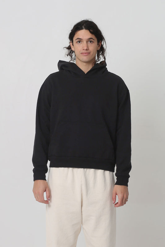 6' person in a size S Black Trash Hoodie. Hem rest at their upper-middle hip.