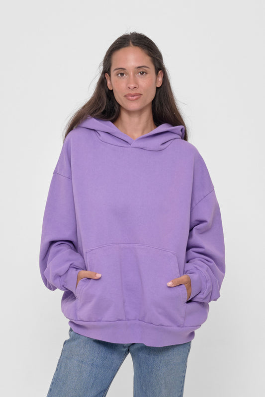 Trash Hoodie in Carpe Diem – front view, model's hands in kangaroo pockets