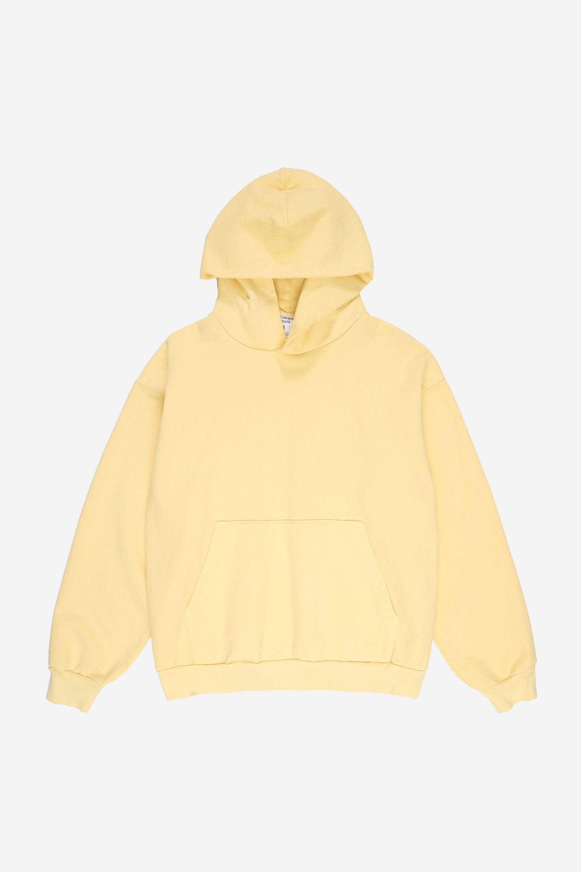 Flat lay front view of French Butter Trash Hoodie with hood lifted above the collar.