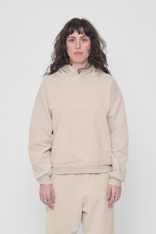 5'6" woman in a size S Oat Trash Hoodie. Hem rests at her lower-middle hip.