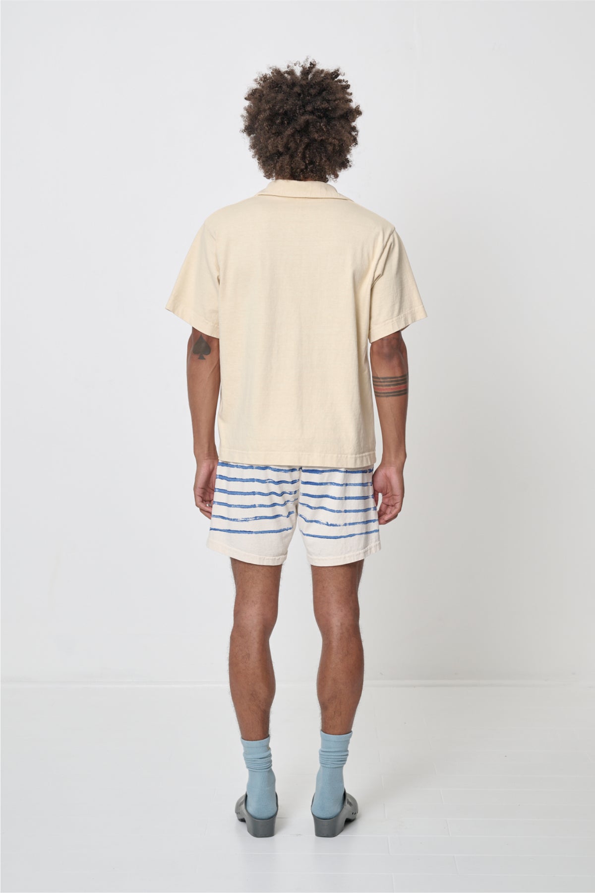 Trash Polo in Turtle Dove - back full body view on model