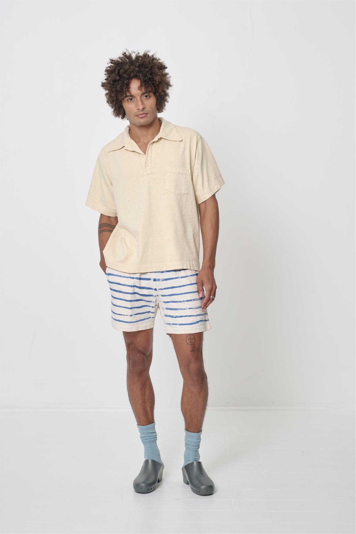 Trash Polo in Turtle Dove - front full body view on model, styled with Everyday Shorts and Squishy Socks