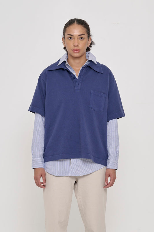 Front view of a 5'8" woman wearing a Trash Polo in Washed Navy over a Stripe Poplin Button-Up Shirt. Hem hits lower-mid hip.