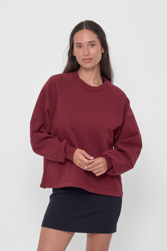 Trash Raglan in Garnet – front view on model
