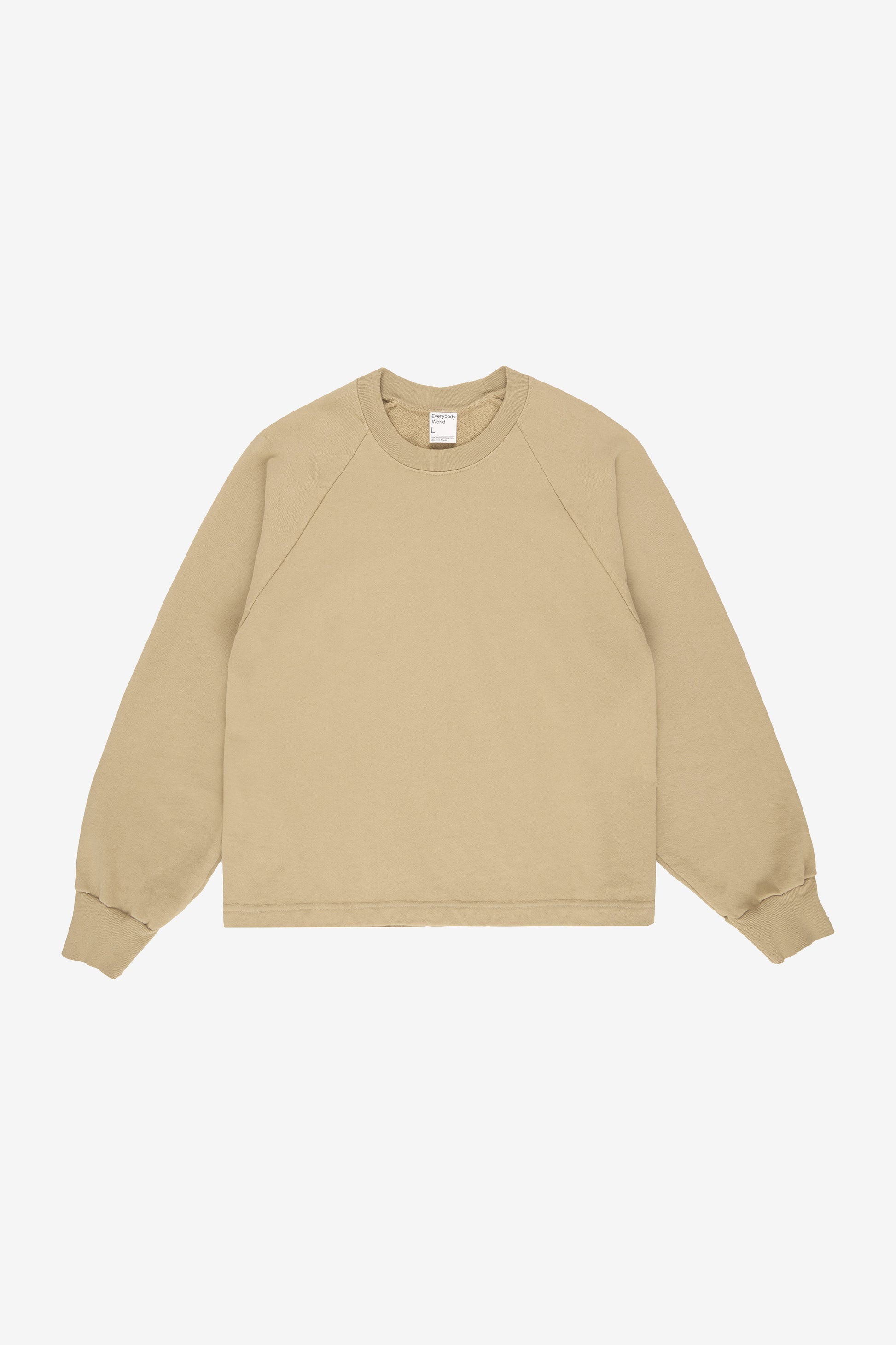 Flat lay shows straight boxy cut of the body and gathers at knit cuffs.