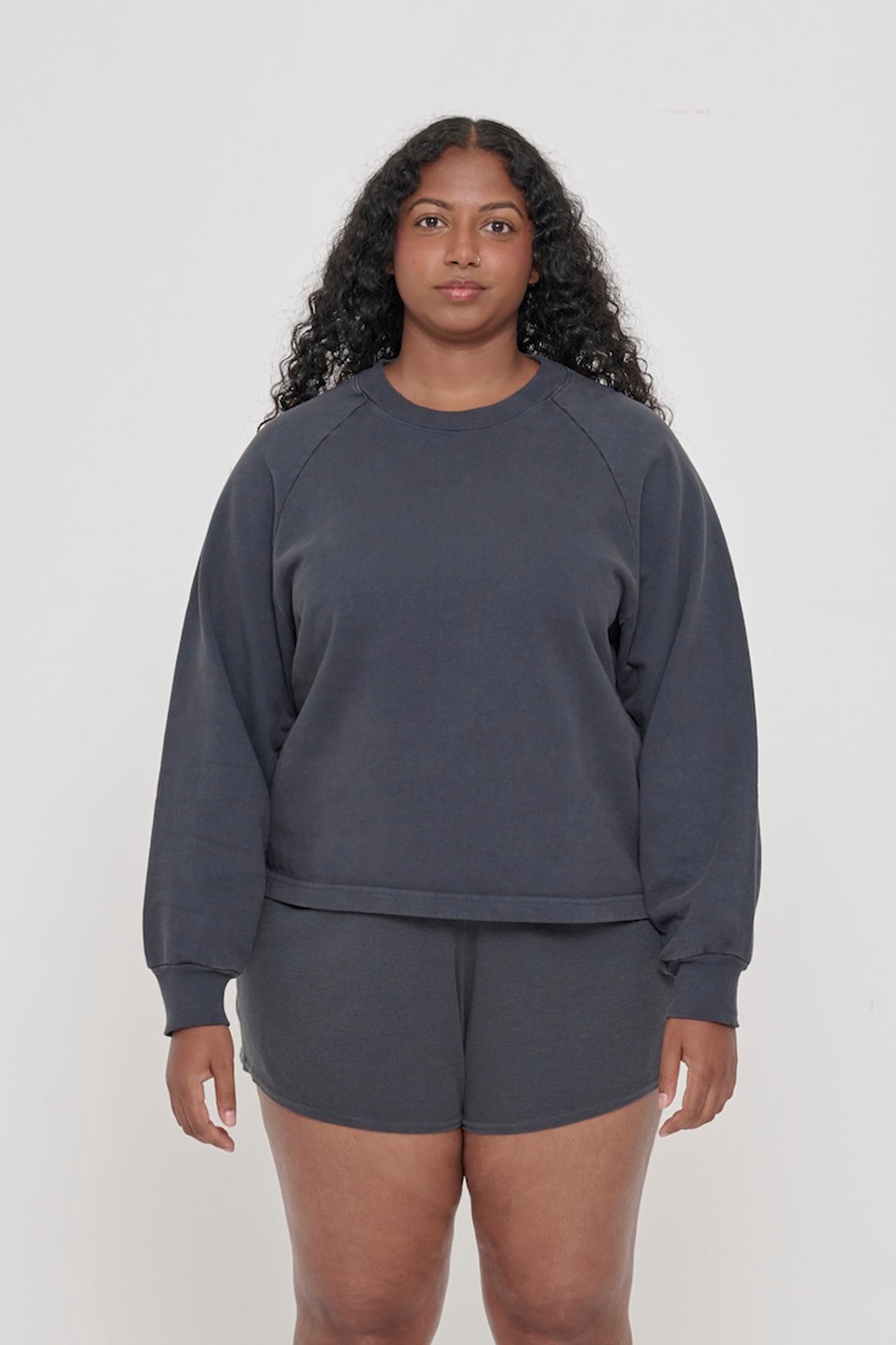 A 5'8" woman in a Slate Trash Raglan, size S. Hem hits her upper hip.