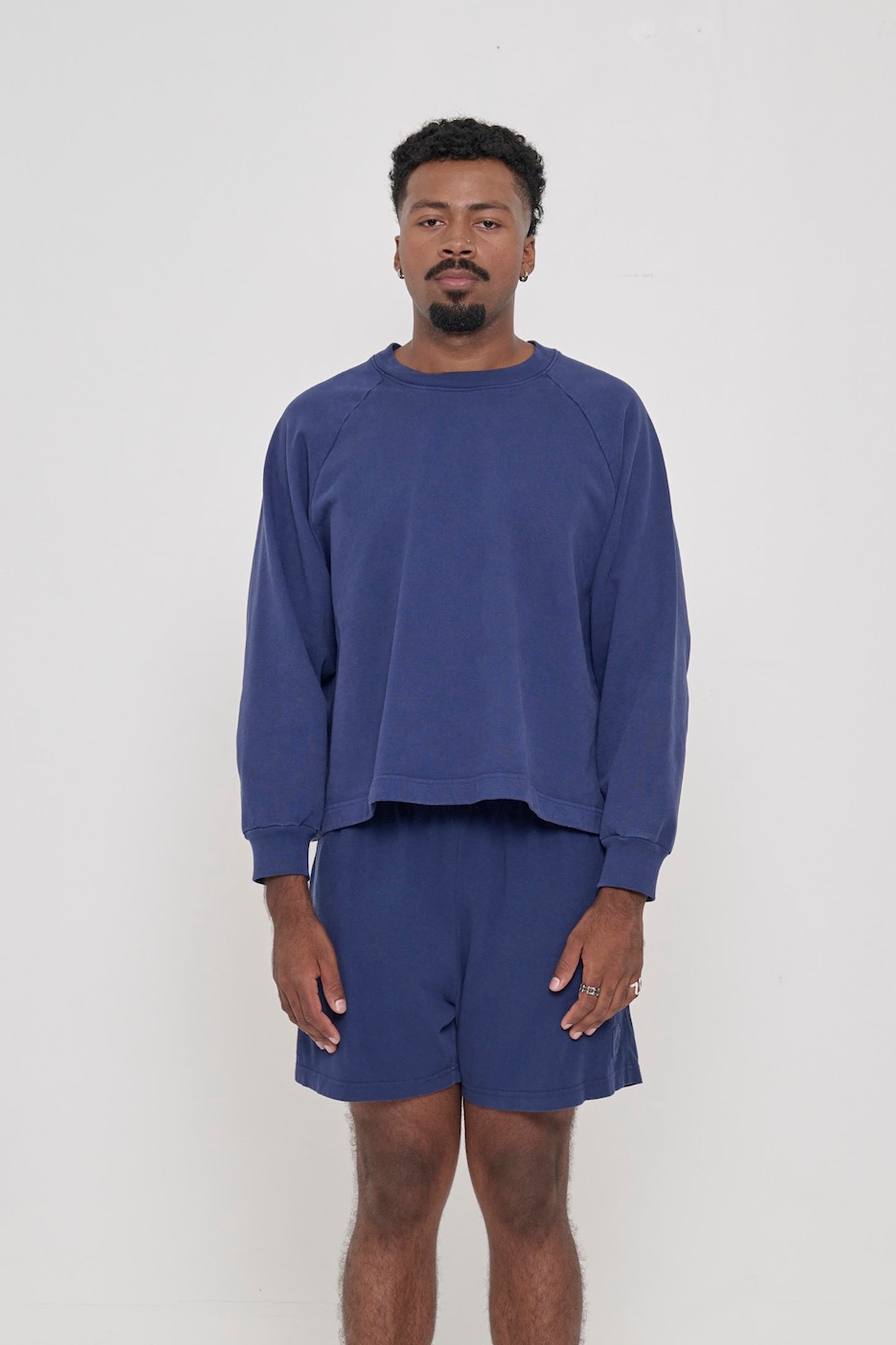 Front view: 6'2" man wearing a Washed Navy Trash Raglan. Hem hits his upper mid hip.
