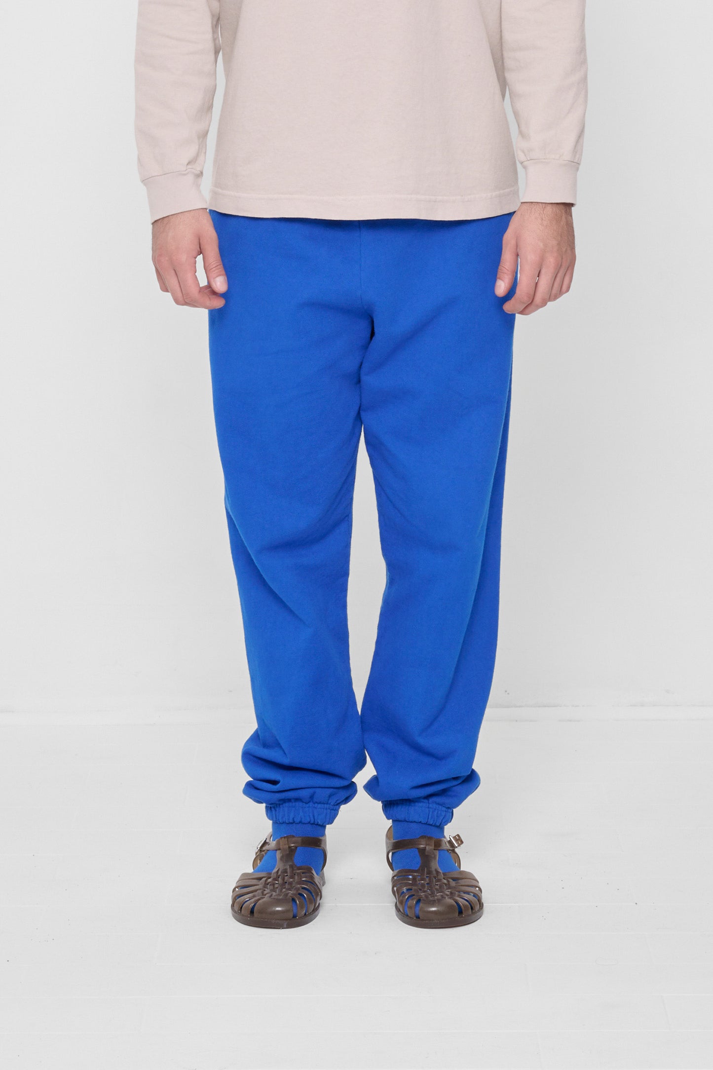 A 6'2" person in size L Lapis Trash Sweatpants. Bunching at the ankles.