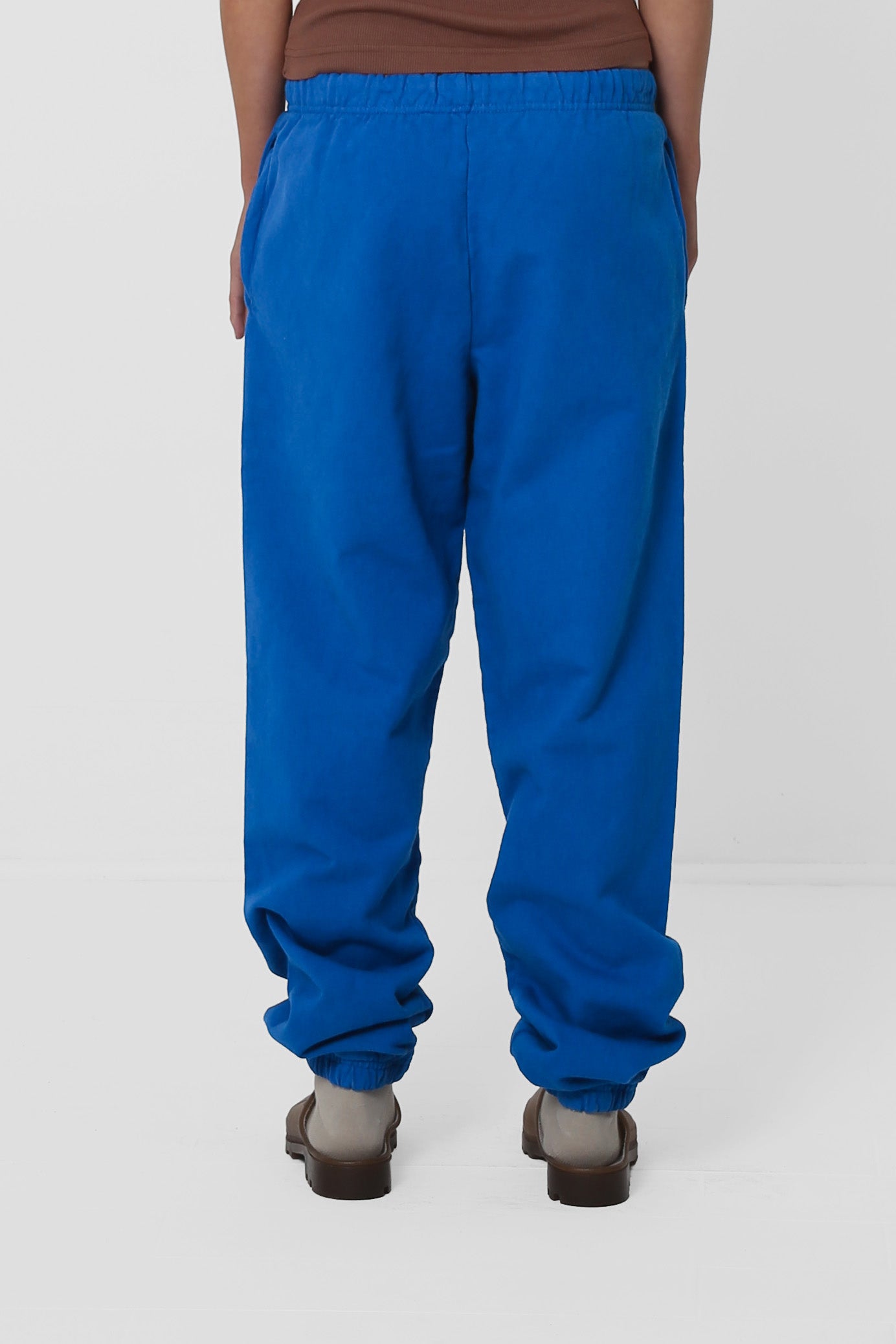 Back view: relaxed fit throughout, and cuffs at the hem.