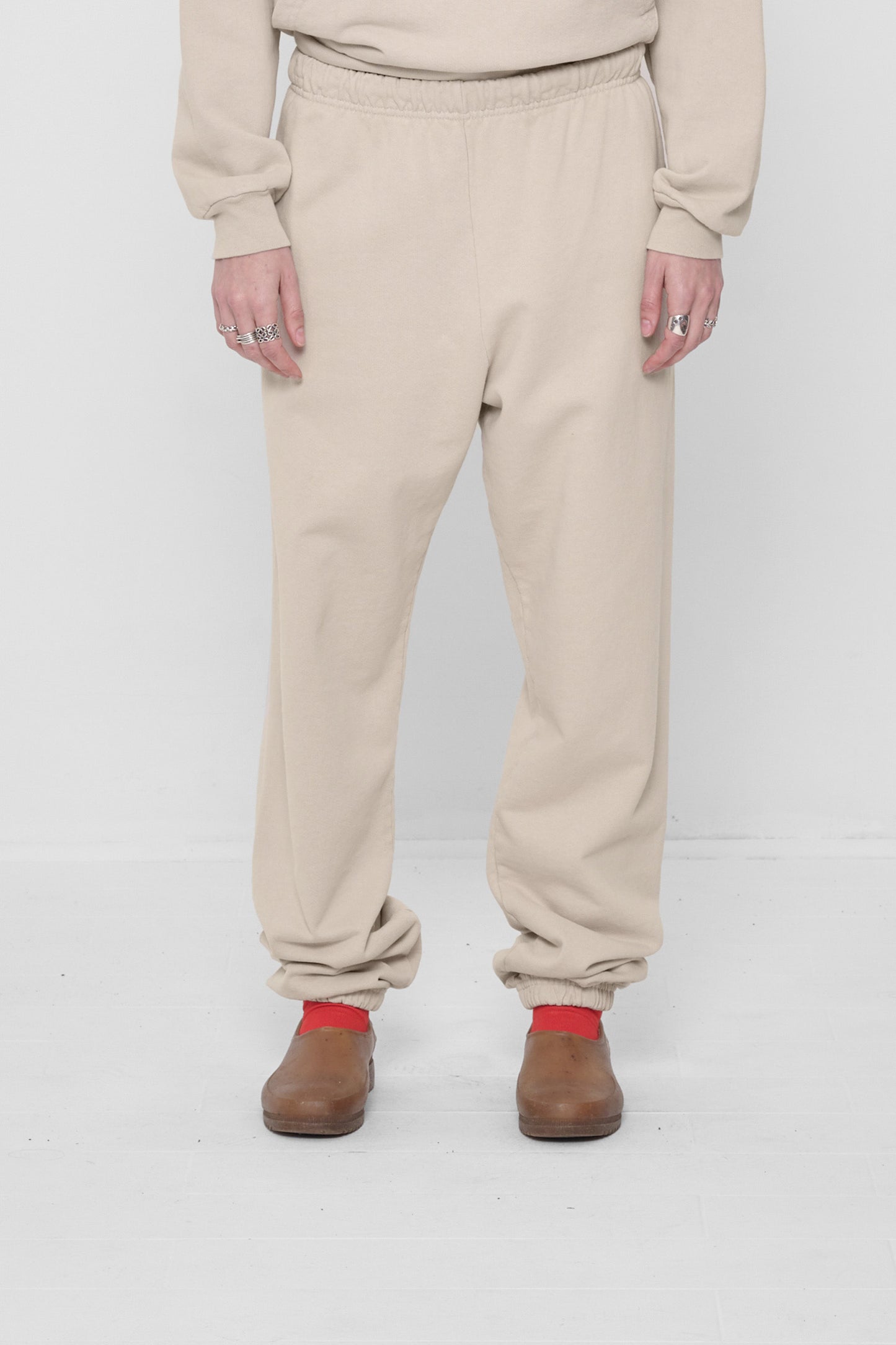 A 5'6" person in size S Oat Trash Sweatpants. Bunching at the ankles.