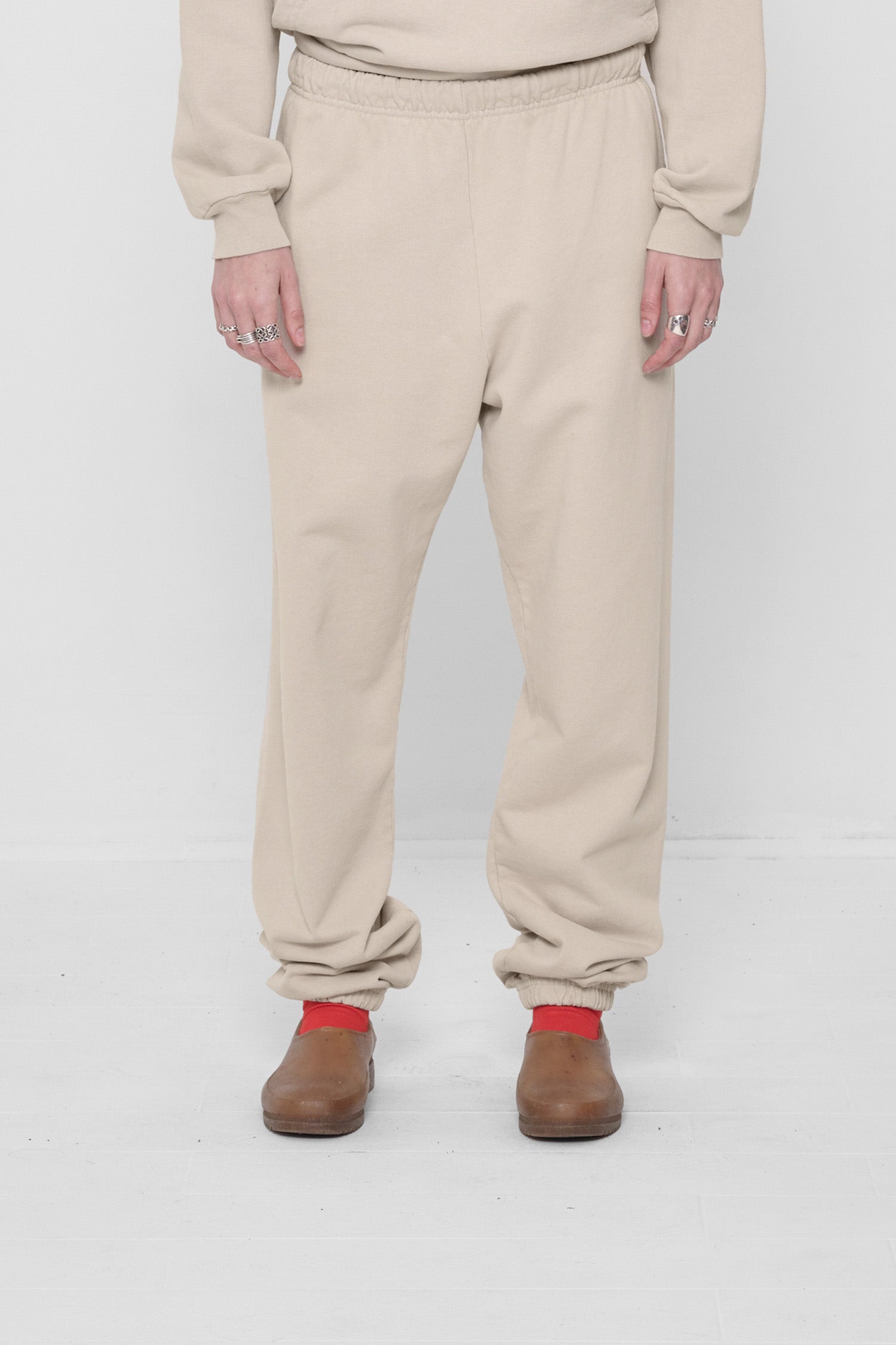 A 5'6" person in size S Oat Trash Sweatpants. Bunching at the ankles.