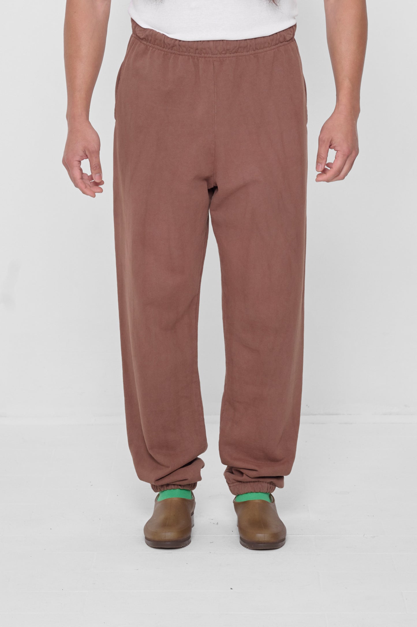 A 5'11" person in size L Potting Soil Trash Sweatpants. Bunching at the ankles.