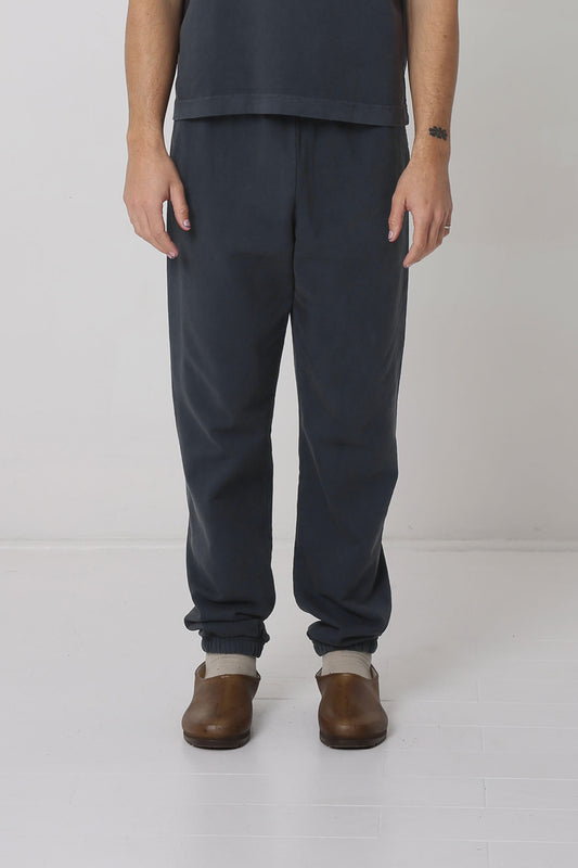 A 6' person in size M Slate Trash Sweatpants. Slight bunching at the ankles.