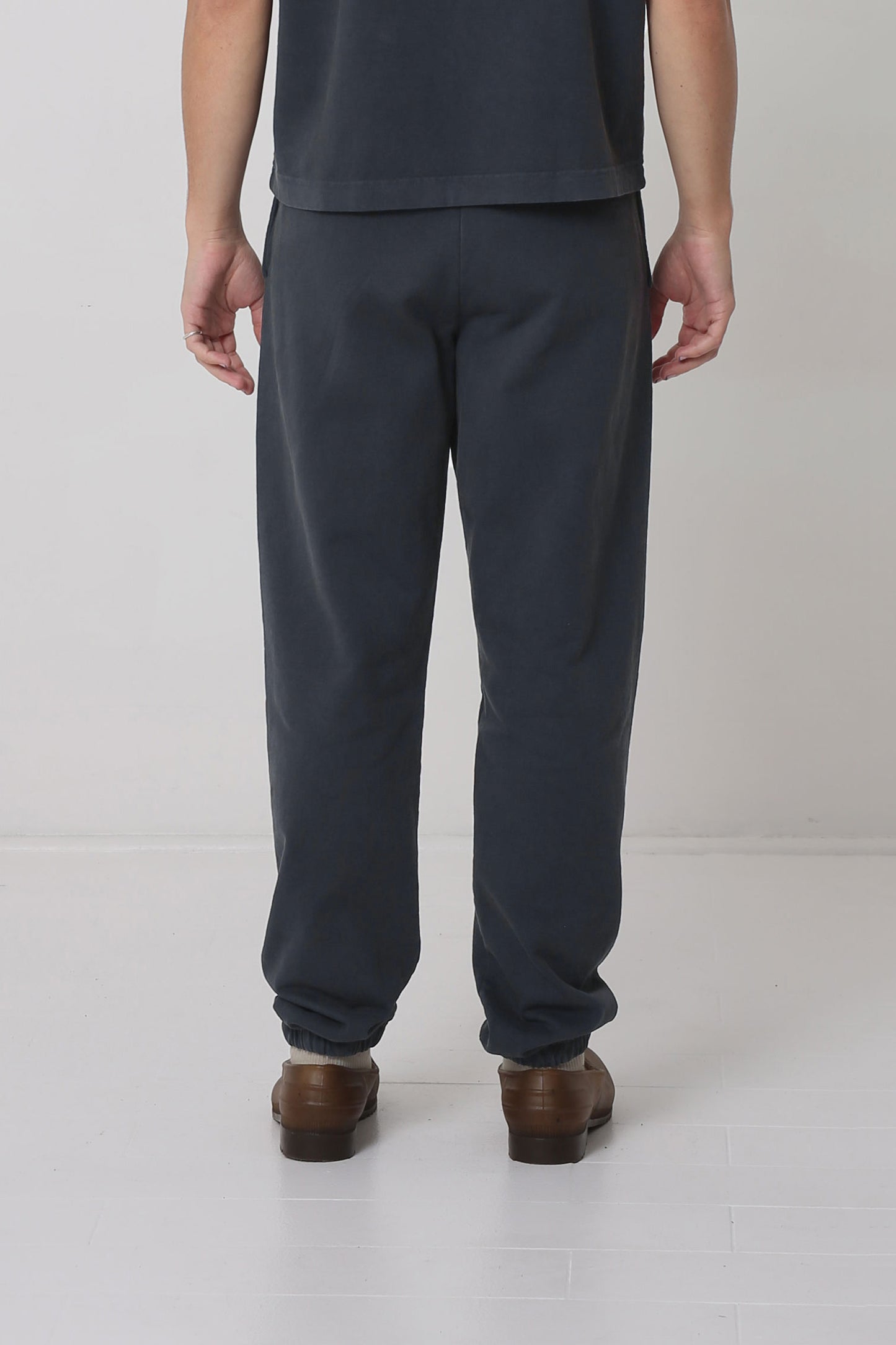 Back view: relaxed fit throughout, except for cuffs at the hem.